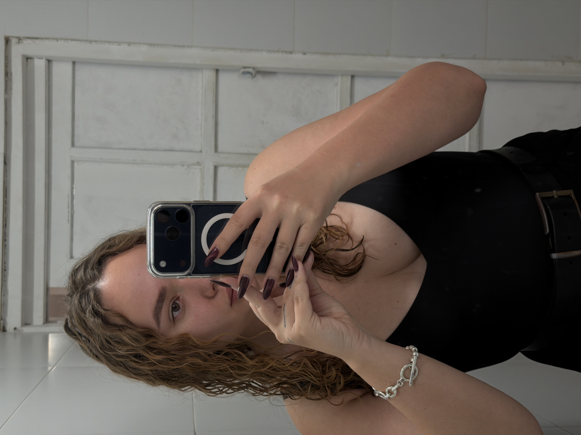 Woman takes selfie in Ramat Gan bathroom