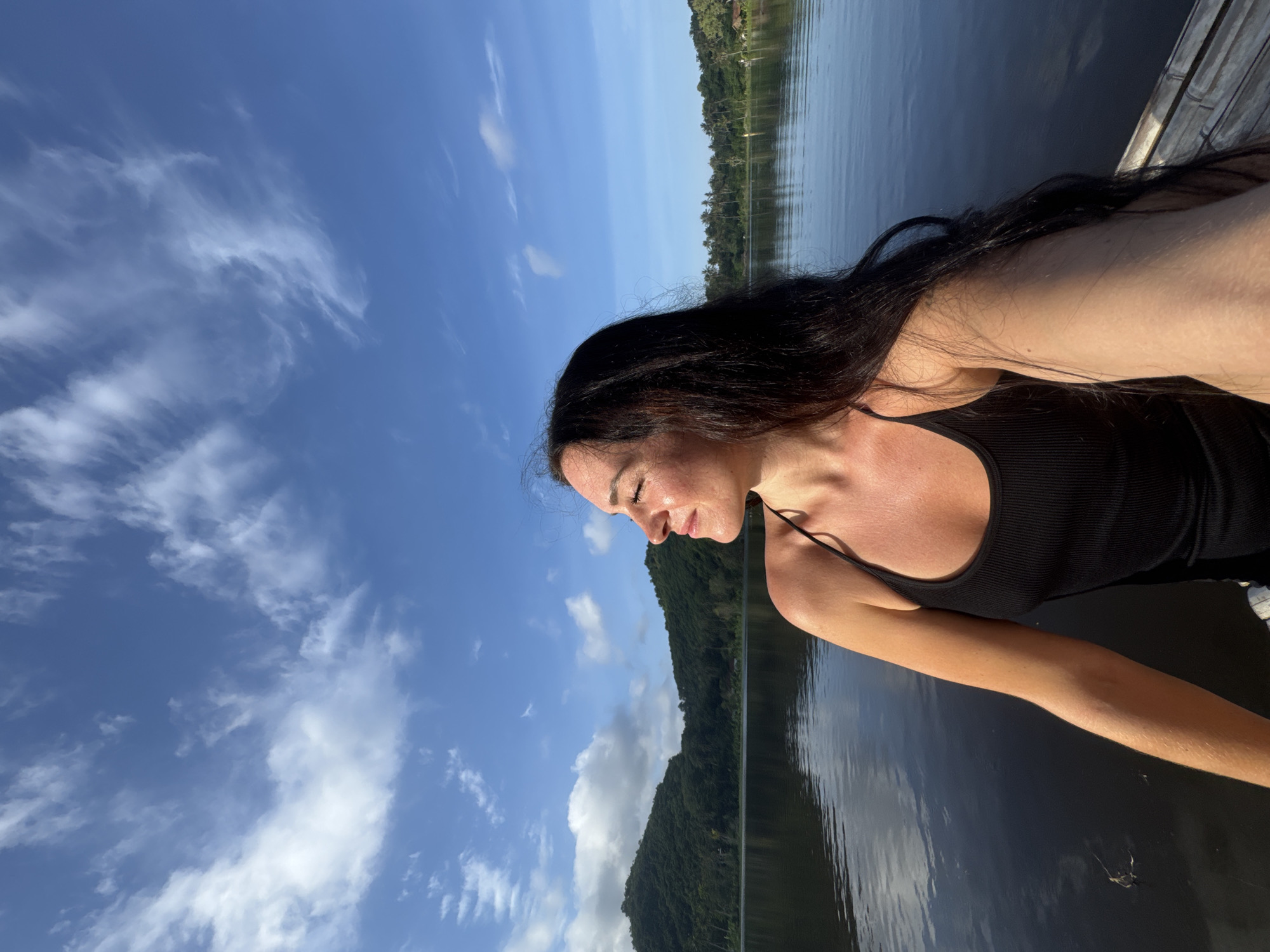 Woman takes selfies on bamboo raft at Indonesian lake