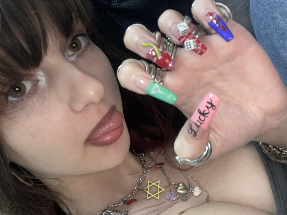 Young woman takes selfies at home in Ra'anana