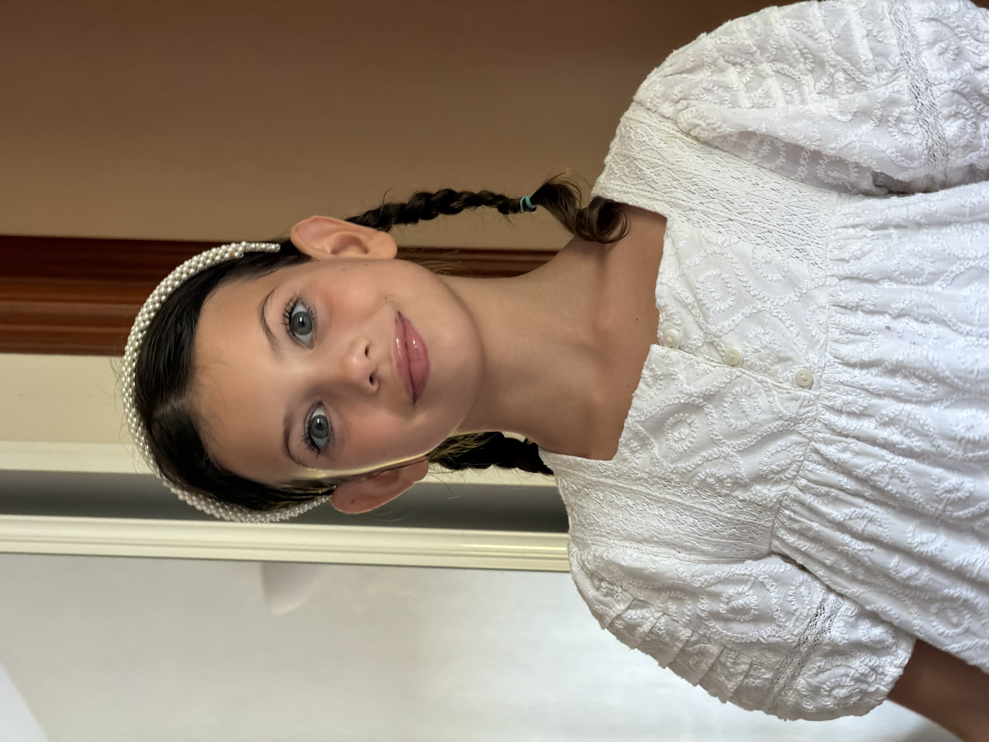 Portrait in white dress and pearl headband, Salou