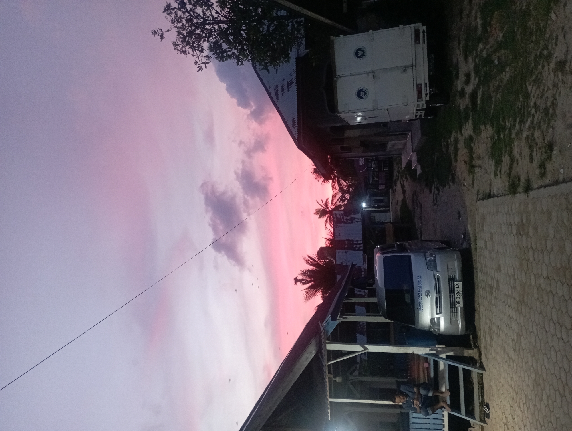 Vibrant pink sunset sky captured in Dayahtuha, Indonesia