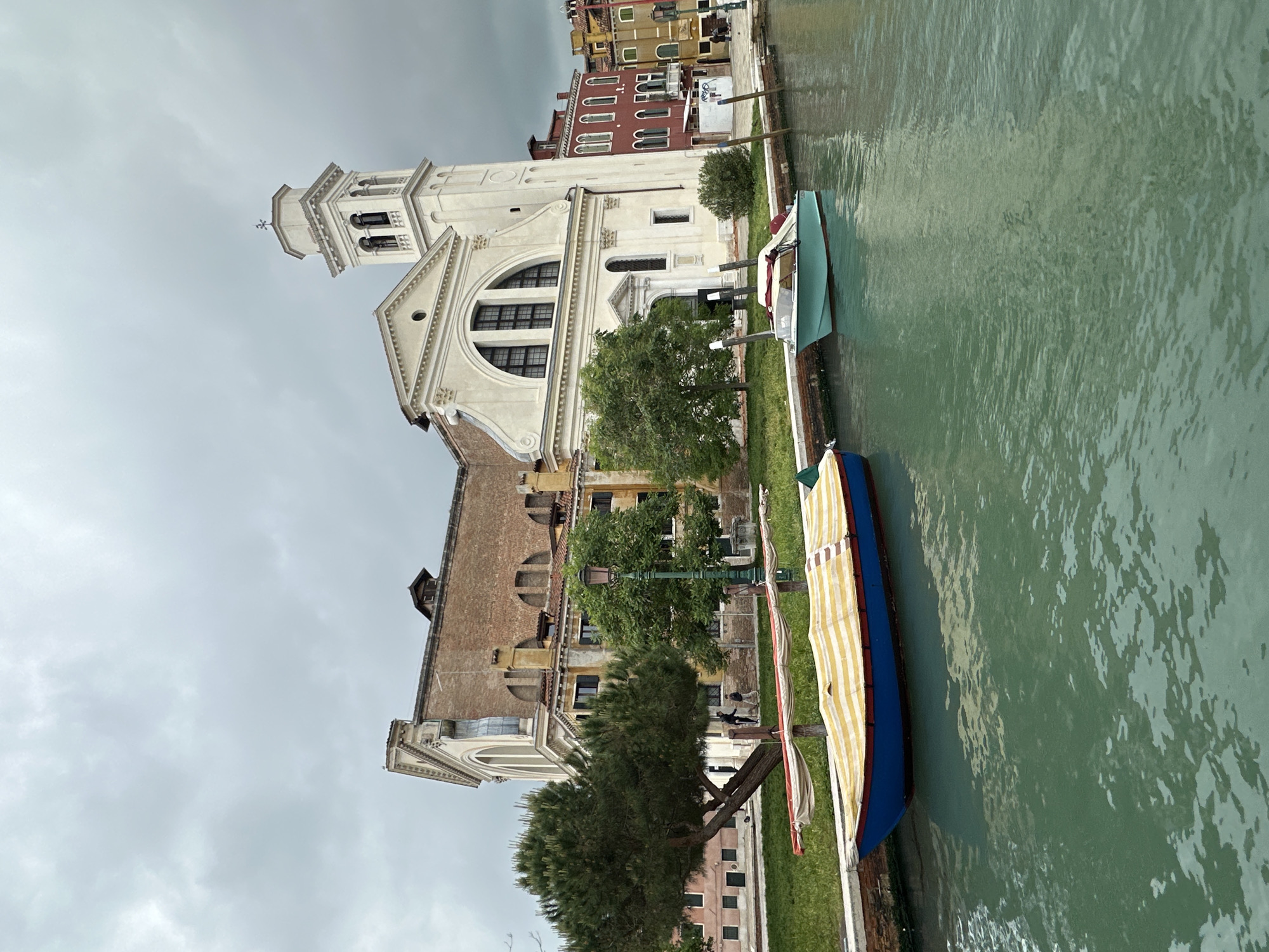 Tourist documents Venice canals and abstract art exhibition
