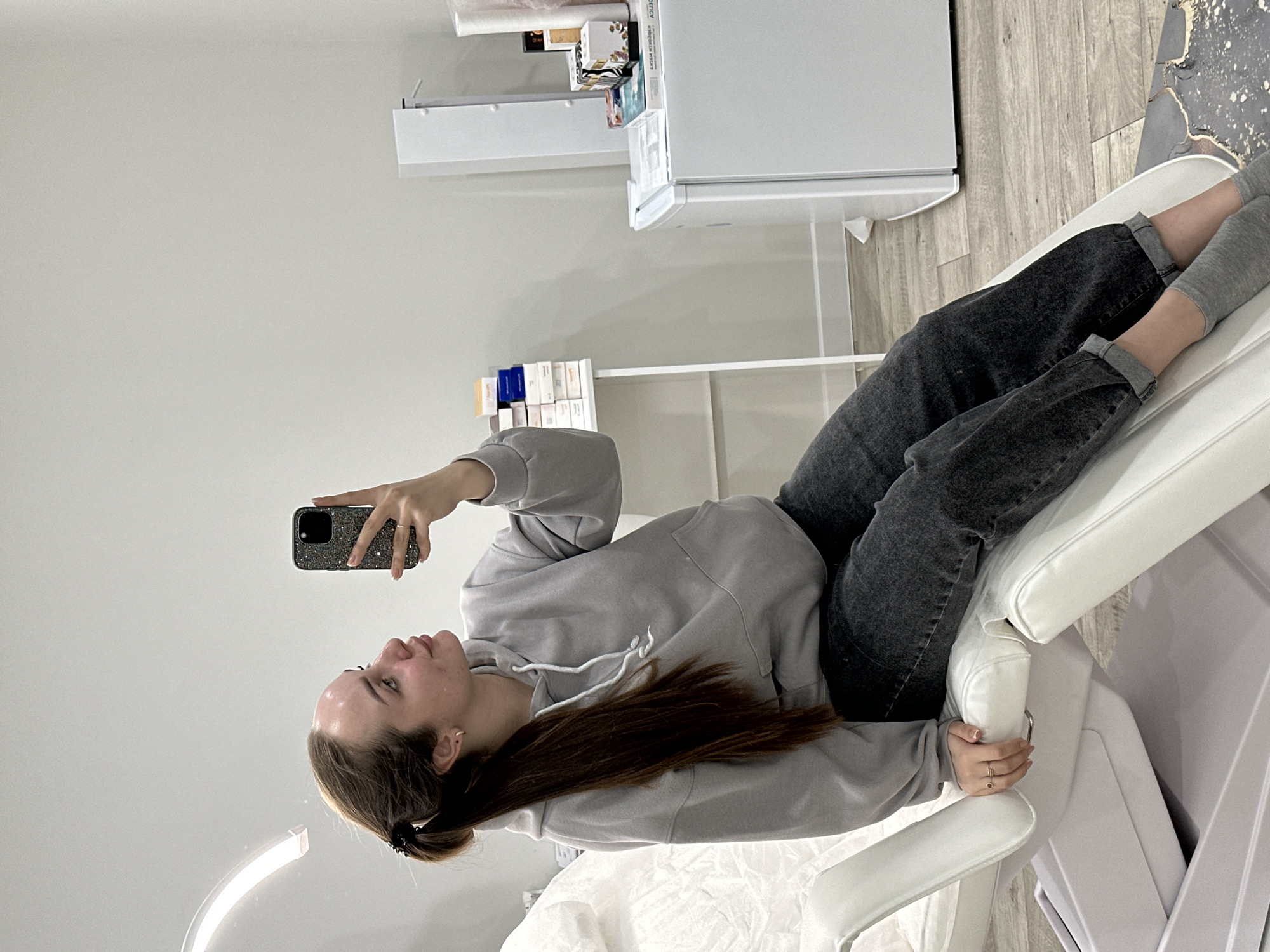 Woman receives facial treatment at medical facility in Russia