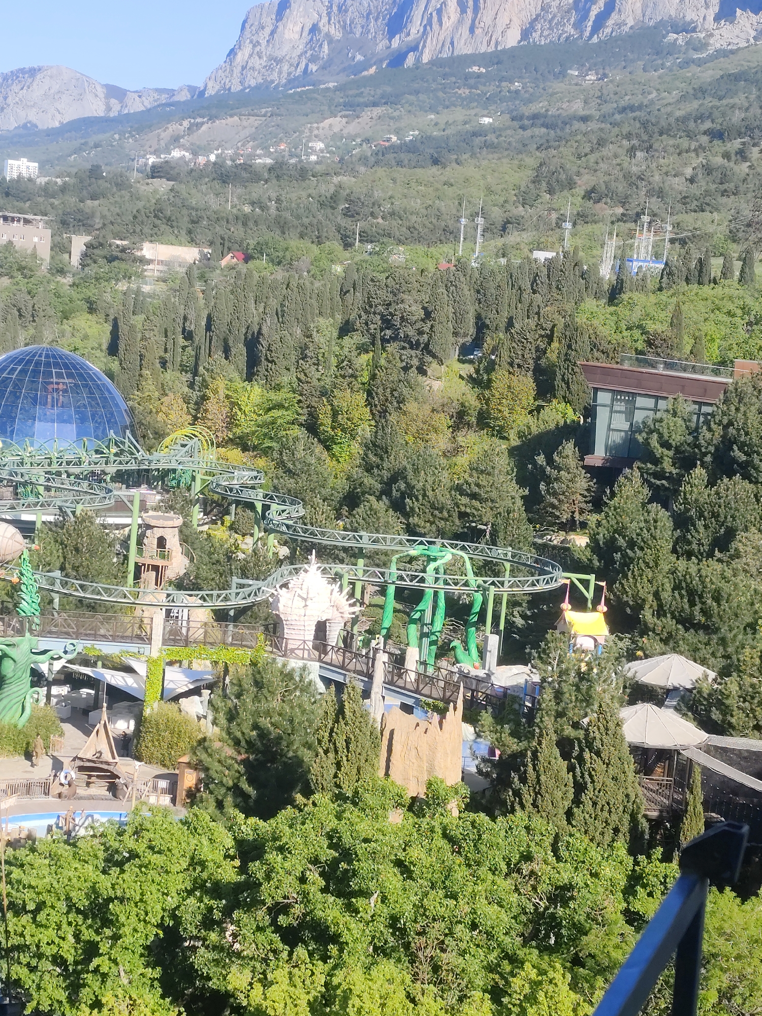 Theme park roller coaster observed from aerial view