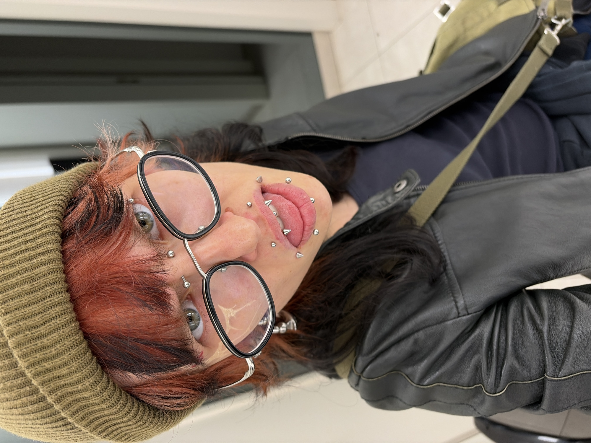 Person with facial piercings photographed in Busmantsi elevator