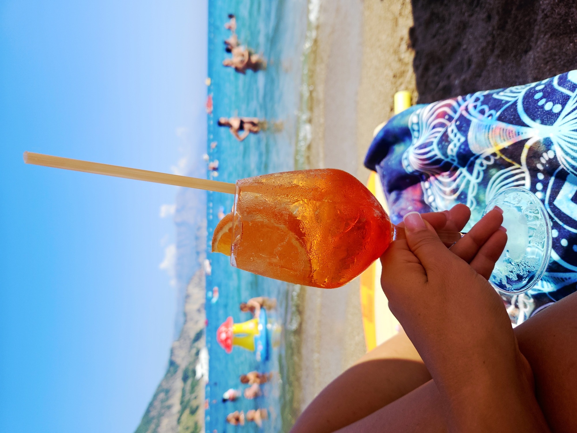 Cold cocktails and a packed beach on a sunny afternoon