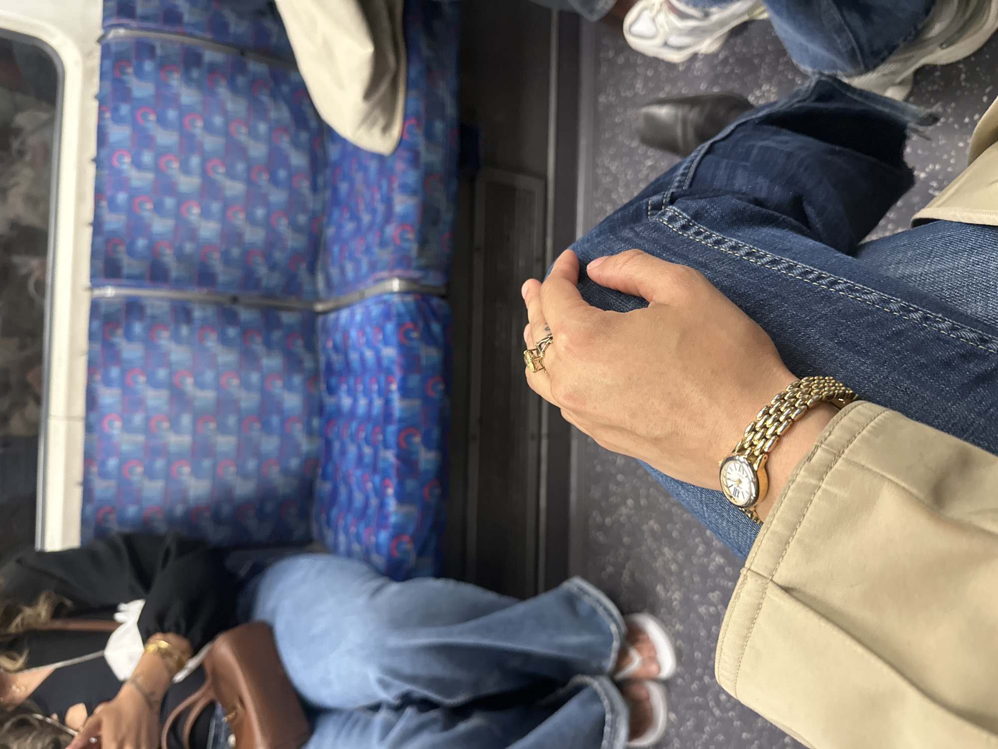 Commuter travels London Underground during evening rush hour