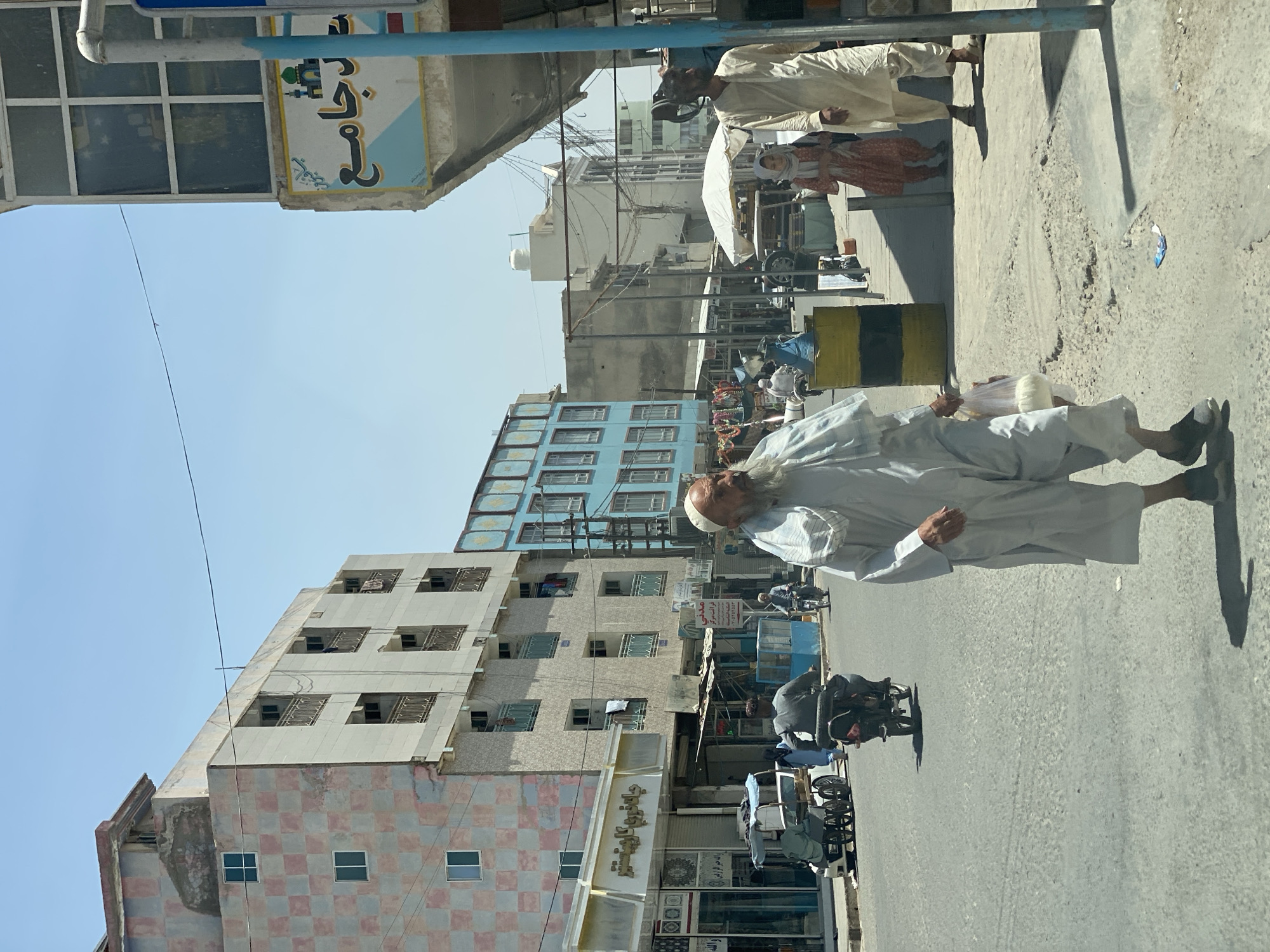 Street vendors and foot traffic fill a Kandahar morning market