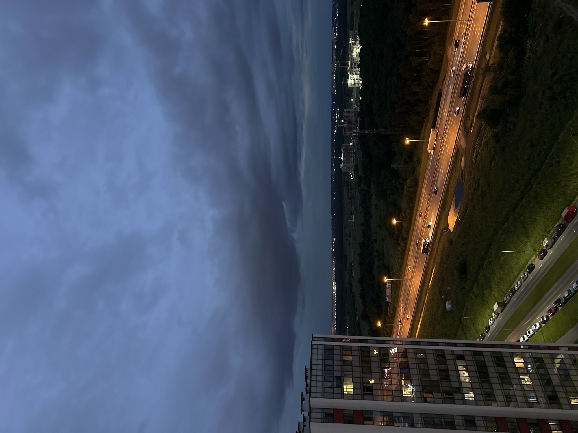 Dusk over Kudrovo's highway corridor, shot from above