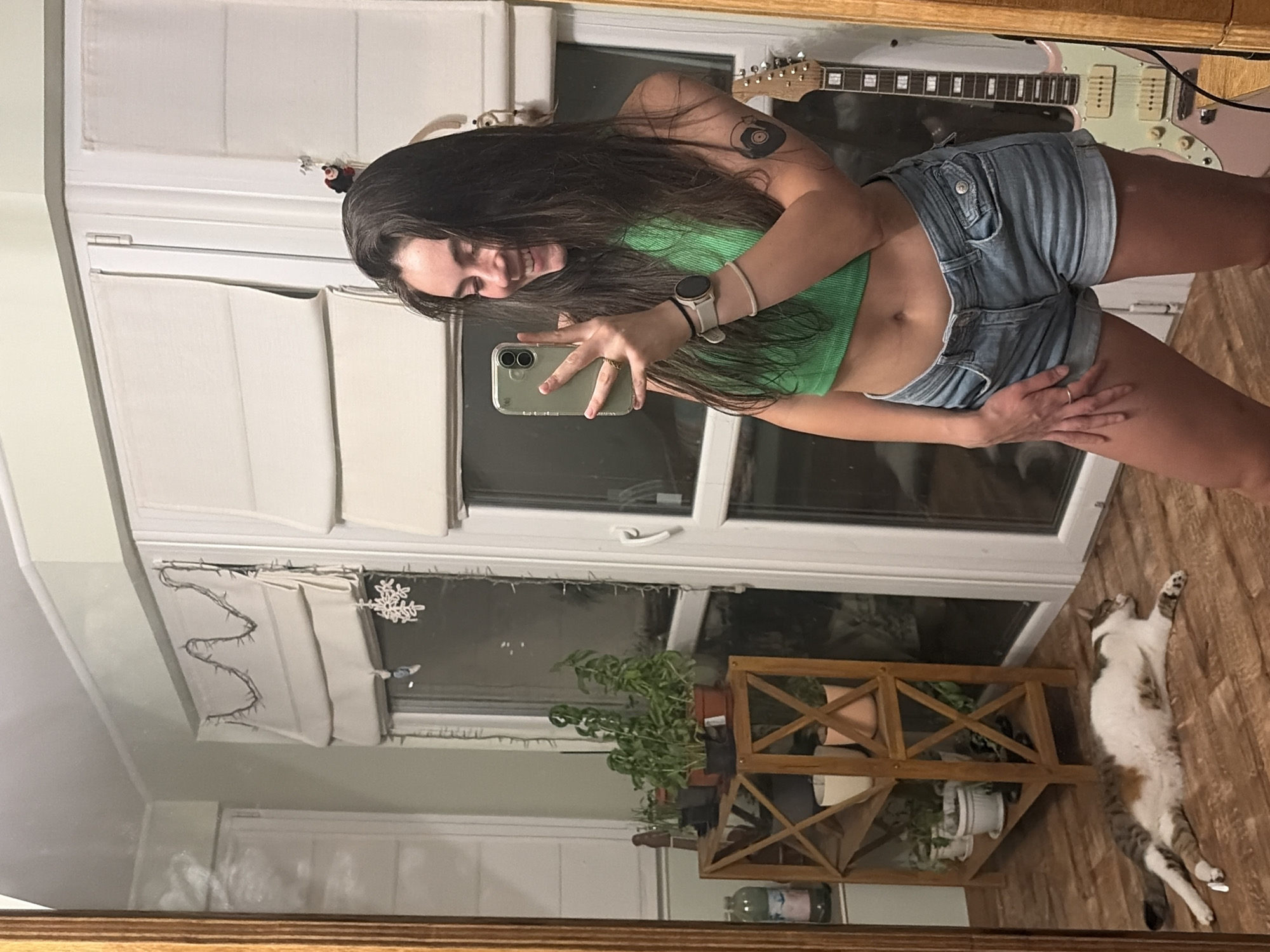 Mirror selfies and a relaxed cat at home