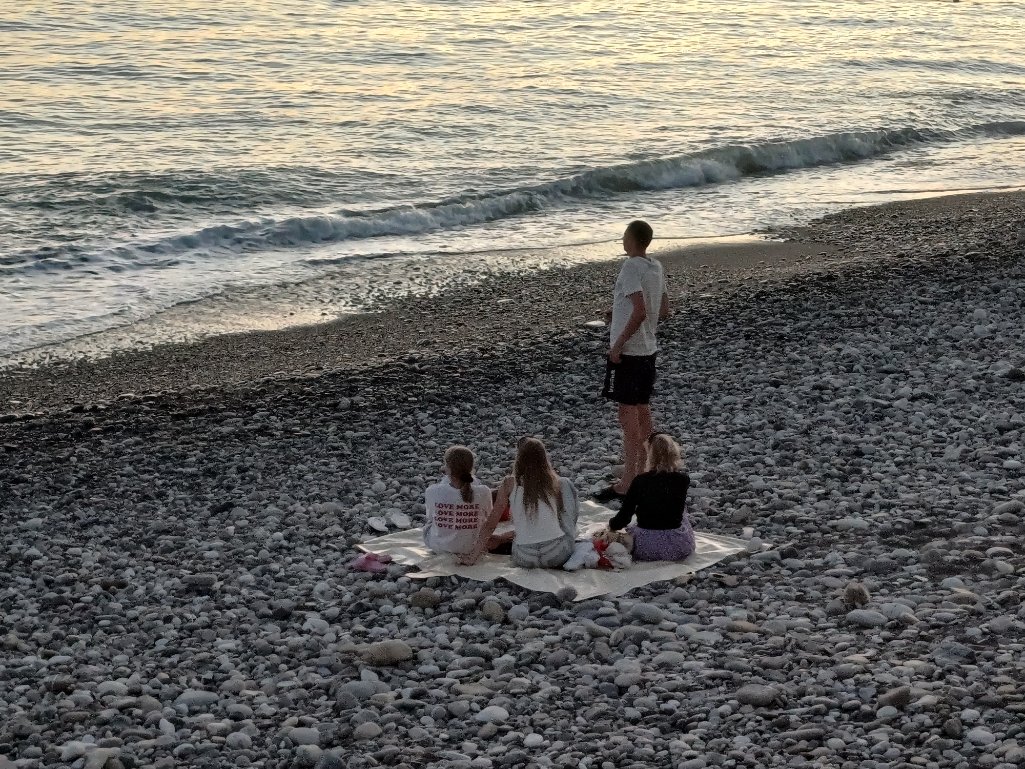 Sunset picnic on Sochi's Black Sea pebble beach