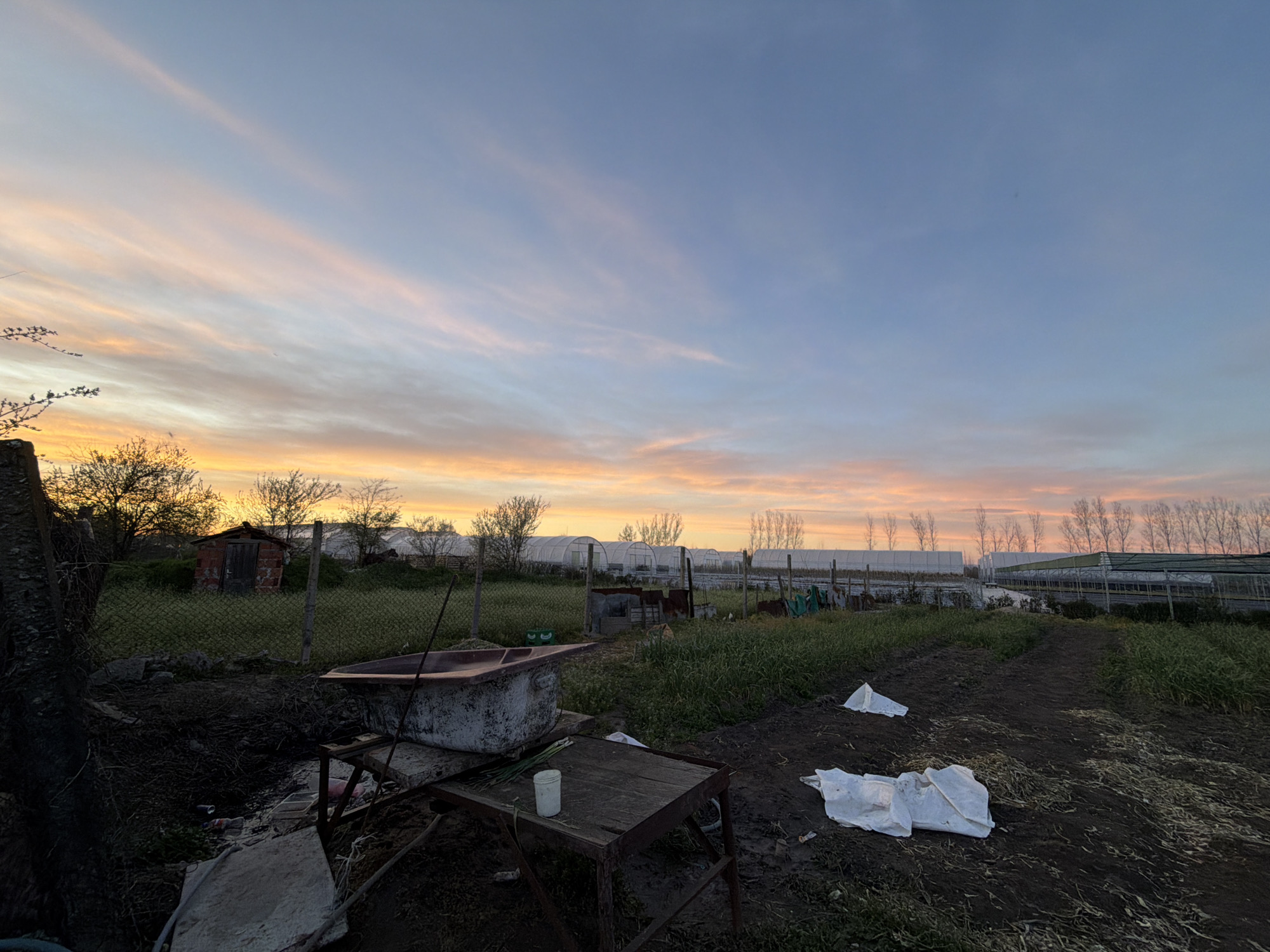 Vehicle parked in rural Liahovo during sunset