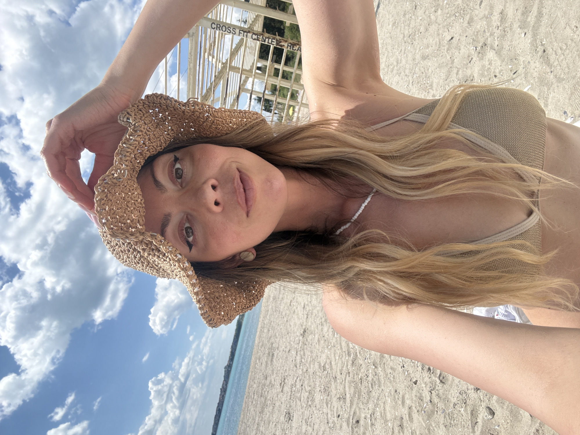 Woman takes selfies in sunny Nesebar, Bulgaria