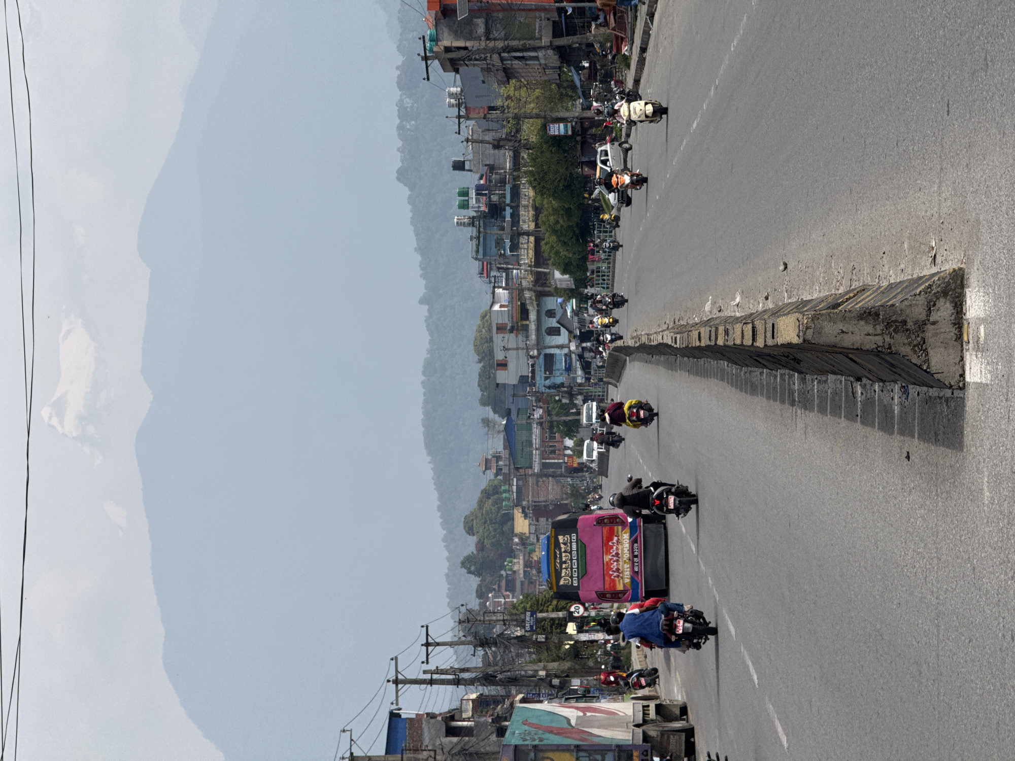 Morning traffic flows through divided streets in Pokhara, Nepal