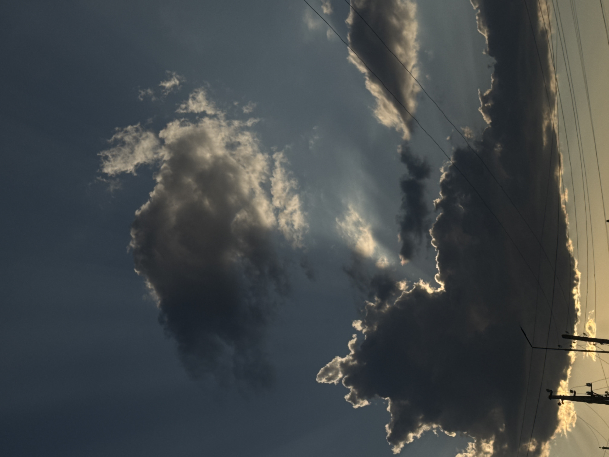 Stormy sunset sky breaks open over Bökönbaev, Kyrgyzstan