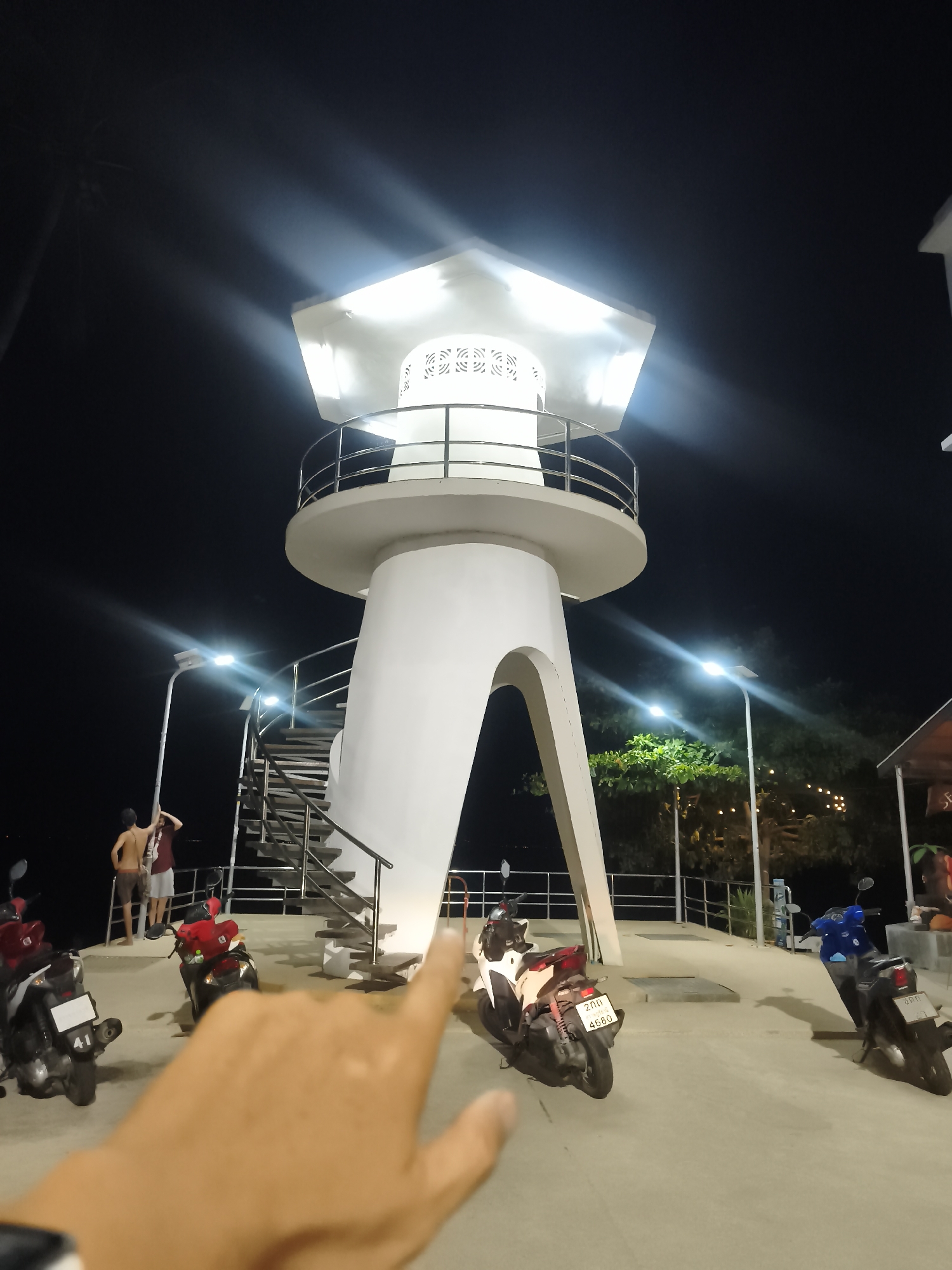 Nighttime street documentation captures illuminated landmarks in Baan Mae Nam