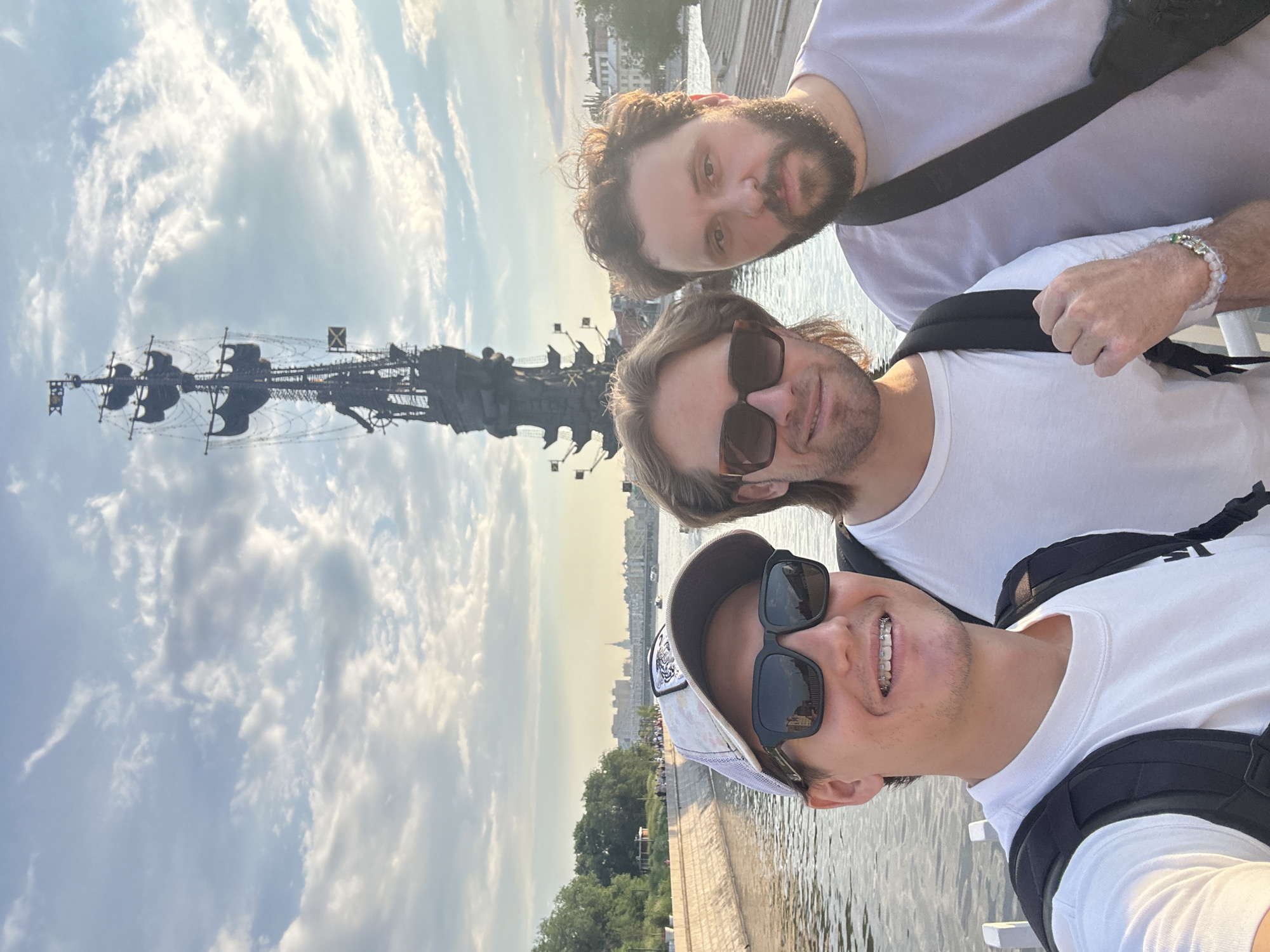 Tourist documents Moscow landmarks during afternoon river tour