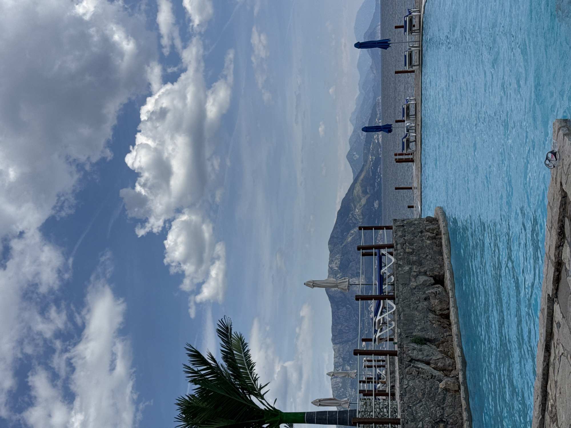 Tourist enjoys poolside relaxation at Montenegro resort