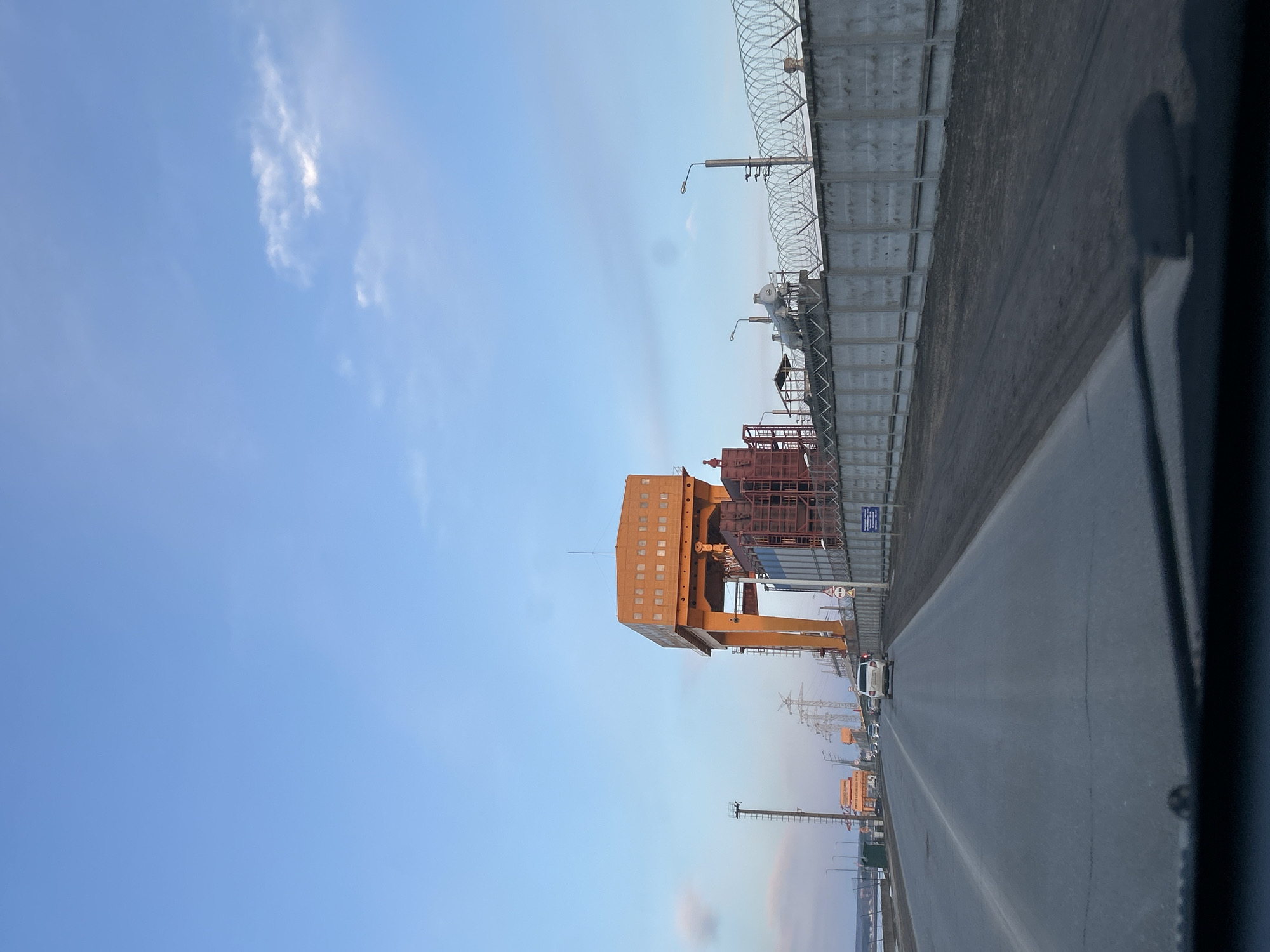 Midday journey through Chaikovsky reveals industrial landscape, frozen reservoir