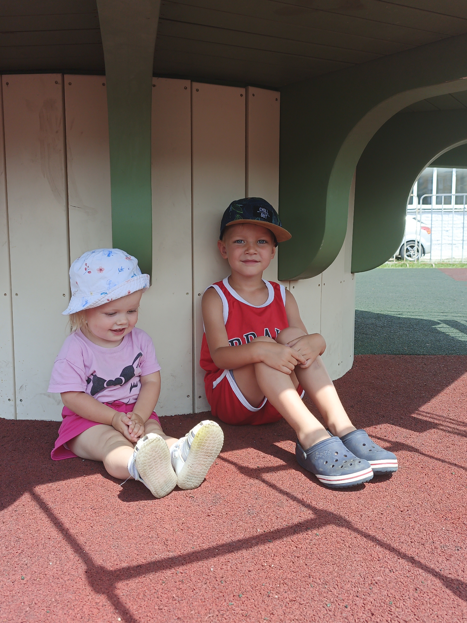 Summer morning at a Zlatoust playground, kids and adults relaxing