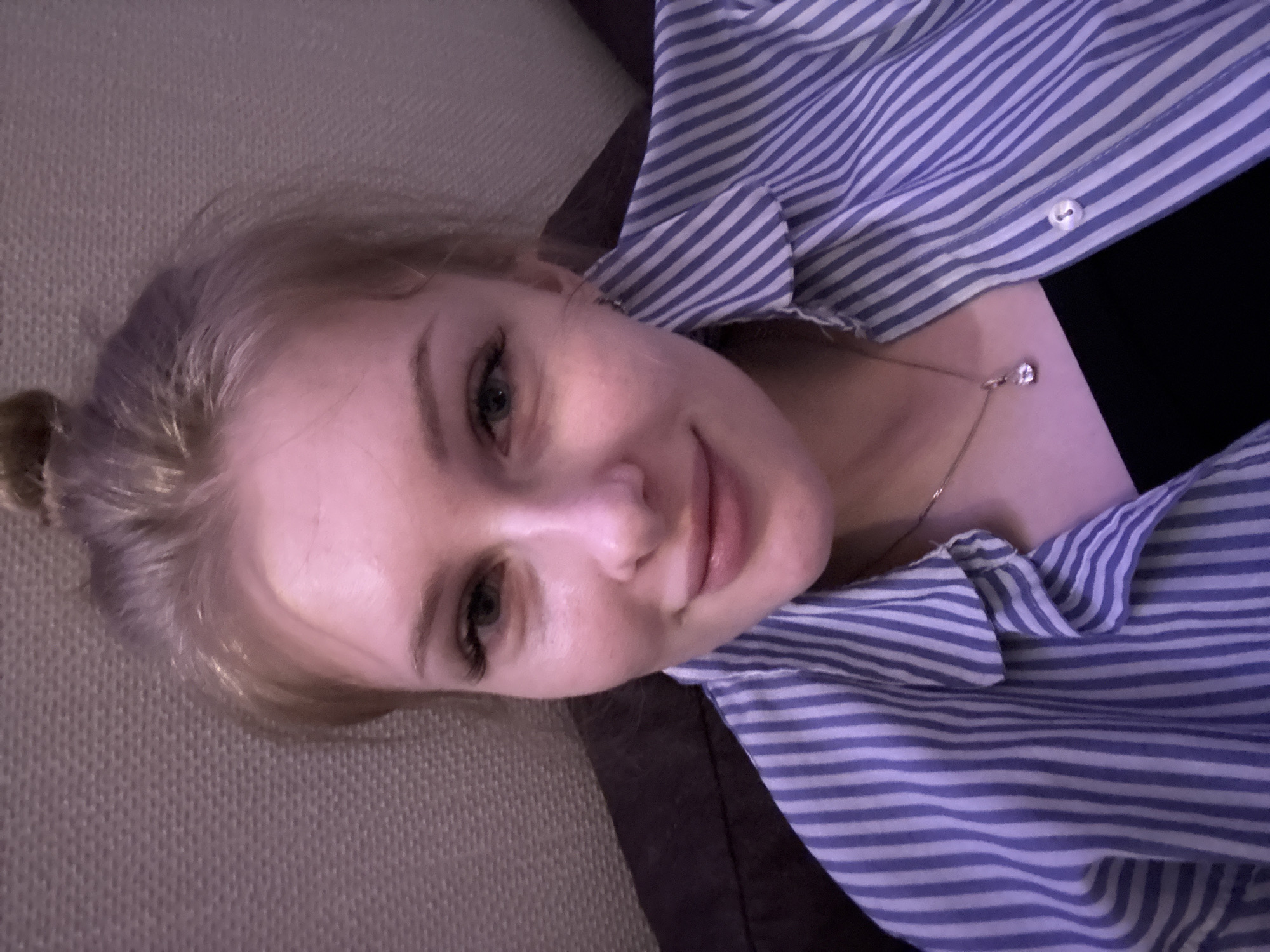 Woman poses playfully for photos in Perm home