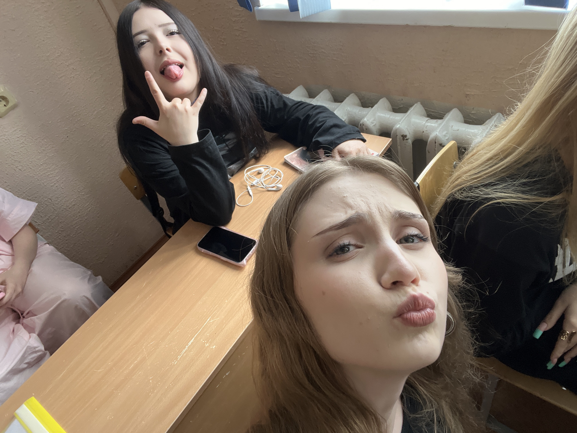 Young women's casual classroom gathering documented in Sterlitamak