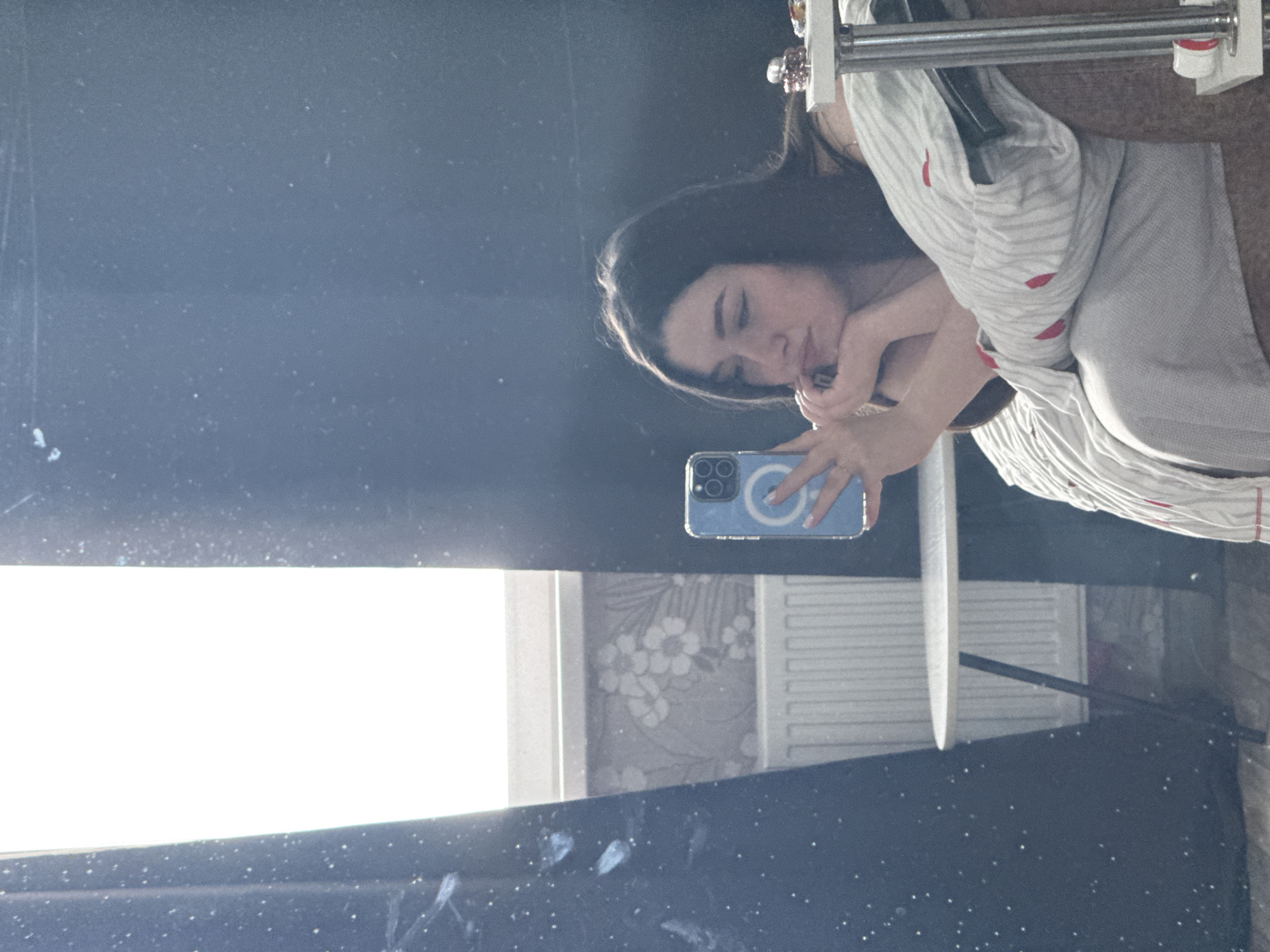 Woman documents morning routine in Perm apartment