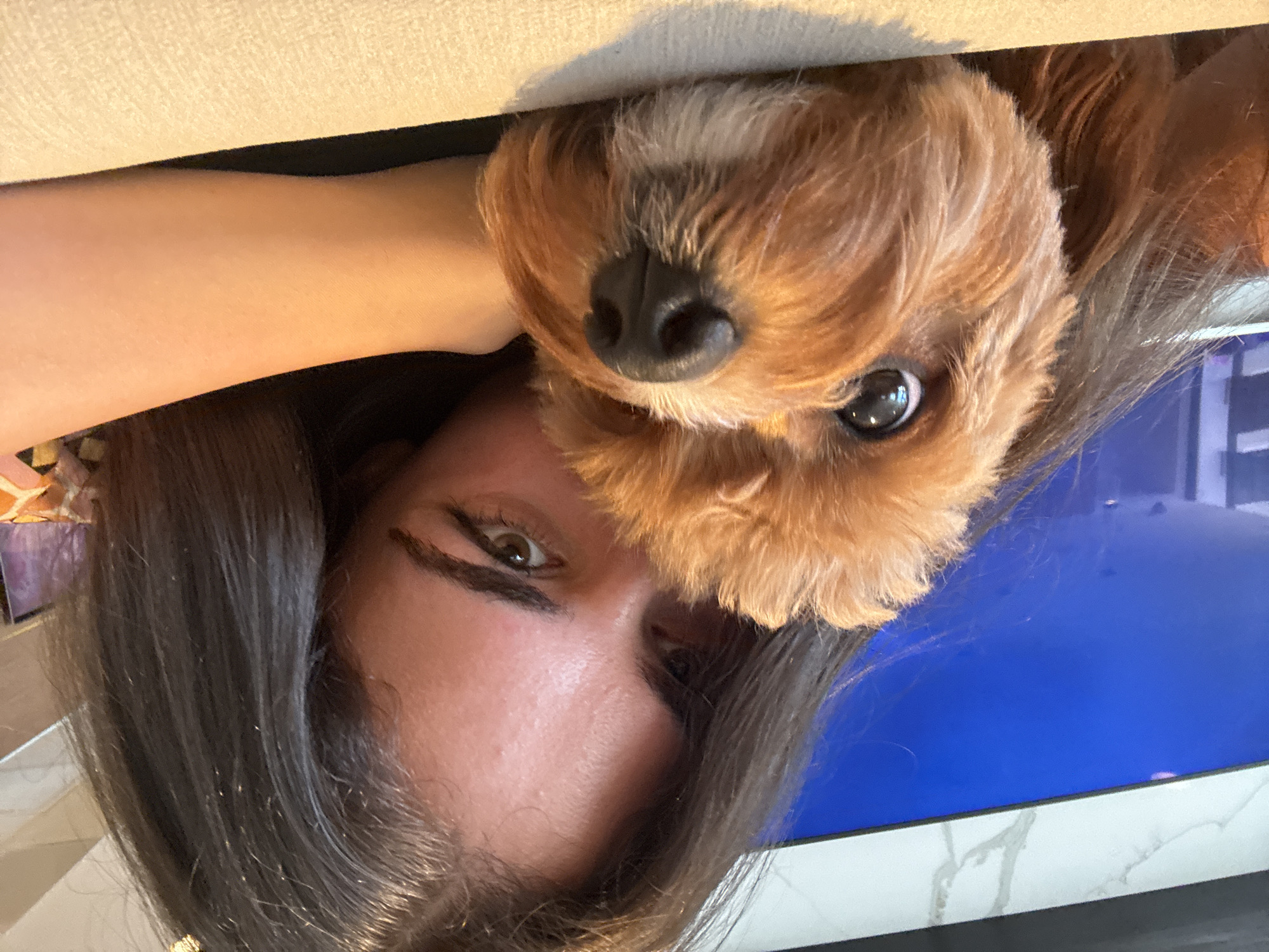 Woman takes selfies with small dog in Boca Raton