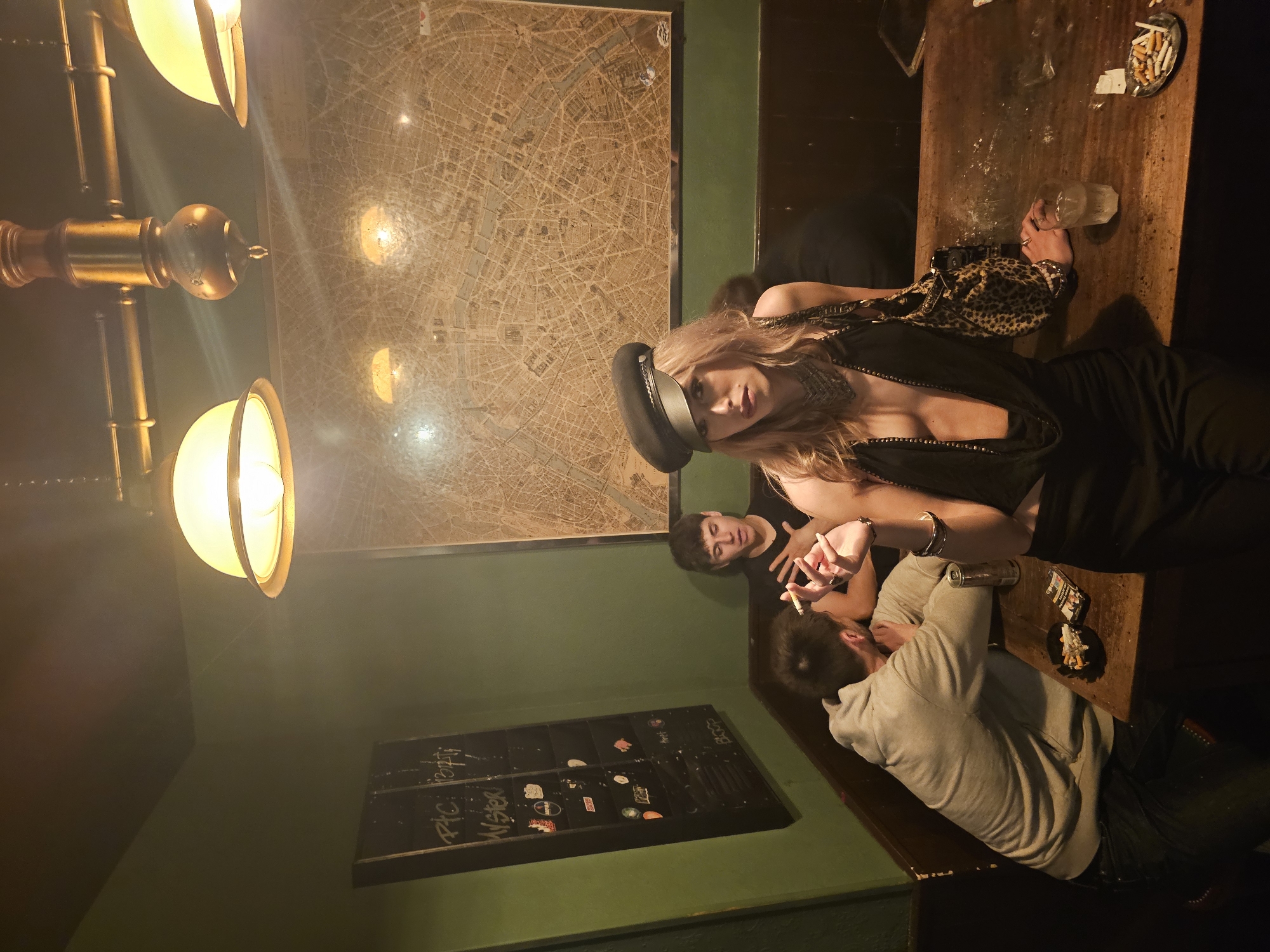 Late night social gathering captured at Paris bar