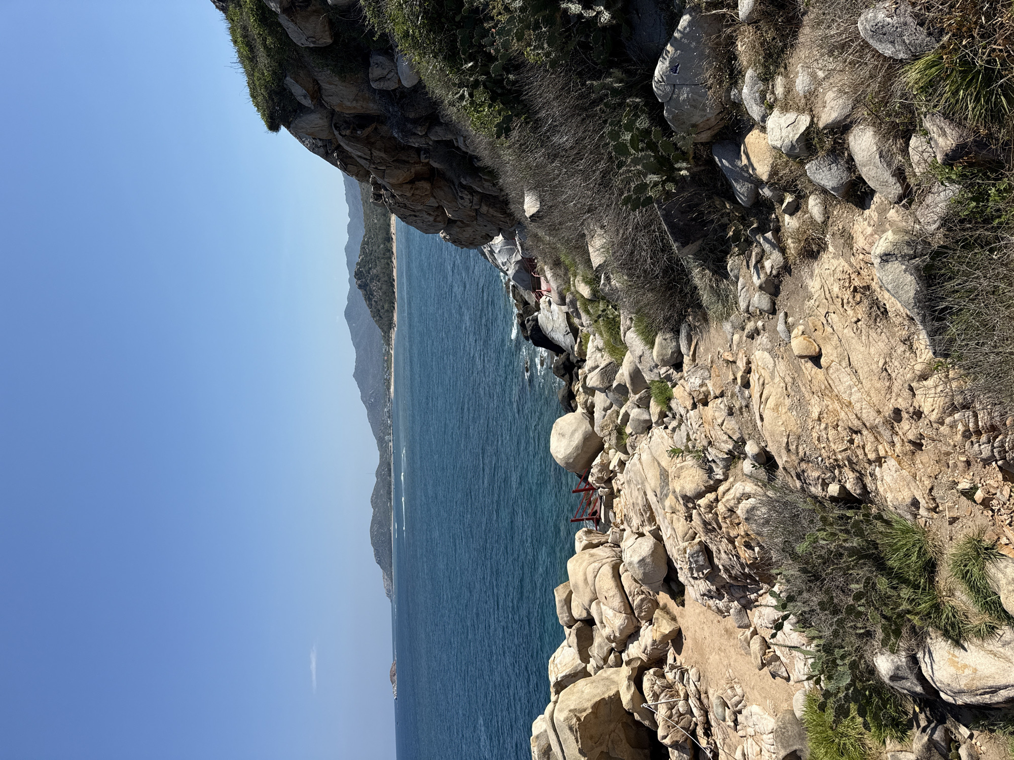 Tourist enjoys scenic morning at Vinh Hai coastal cliffs