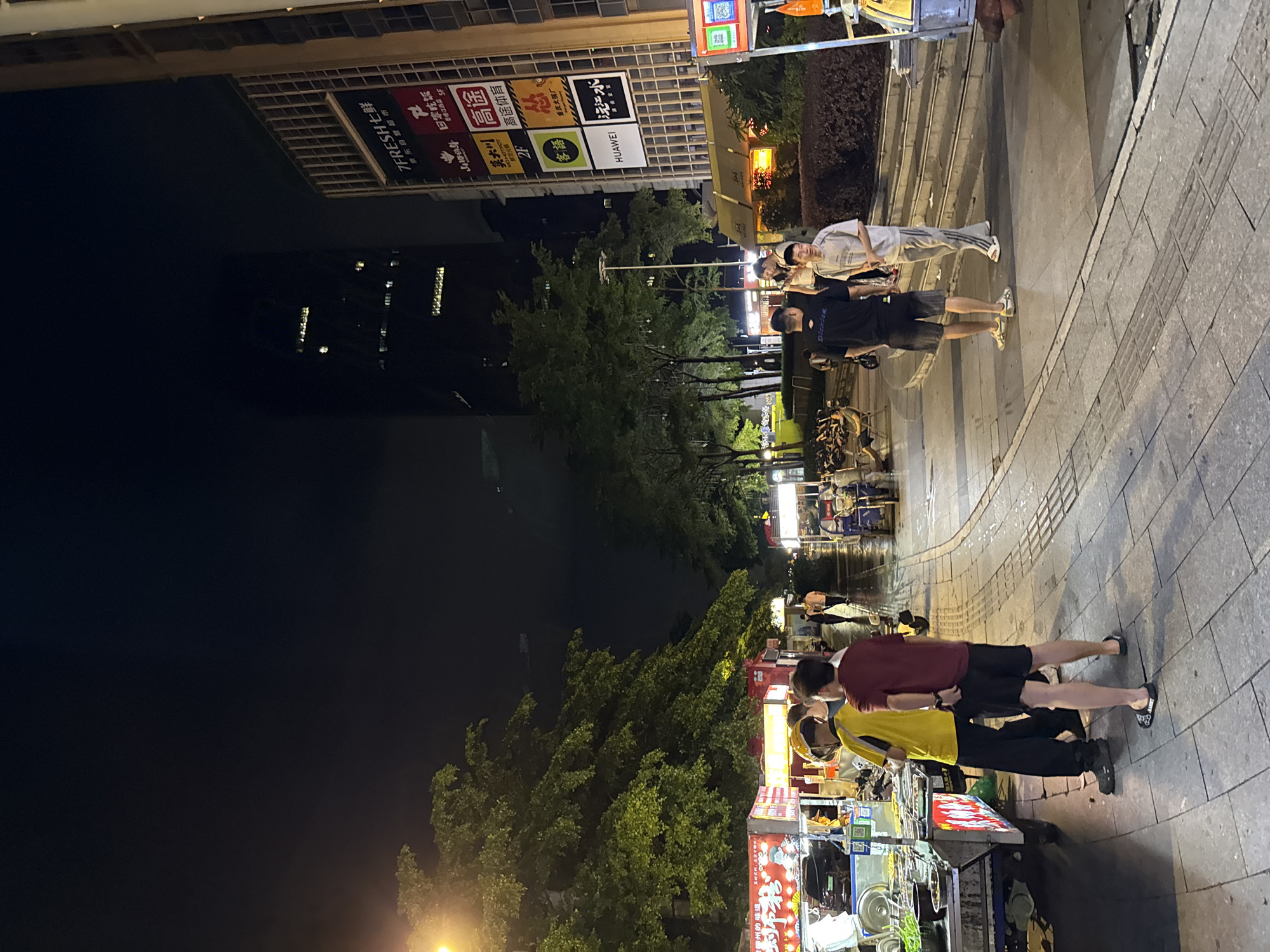 Haizhu District streets buzzing on a rainy June night