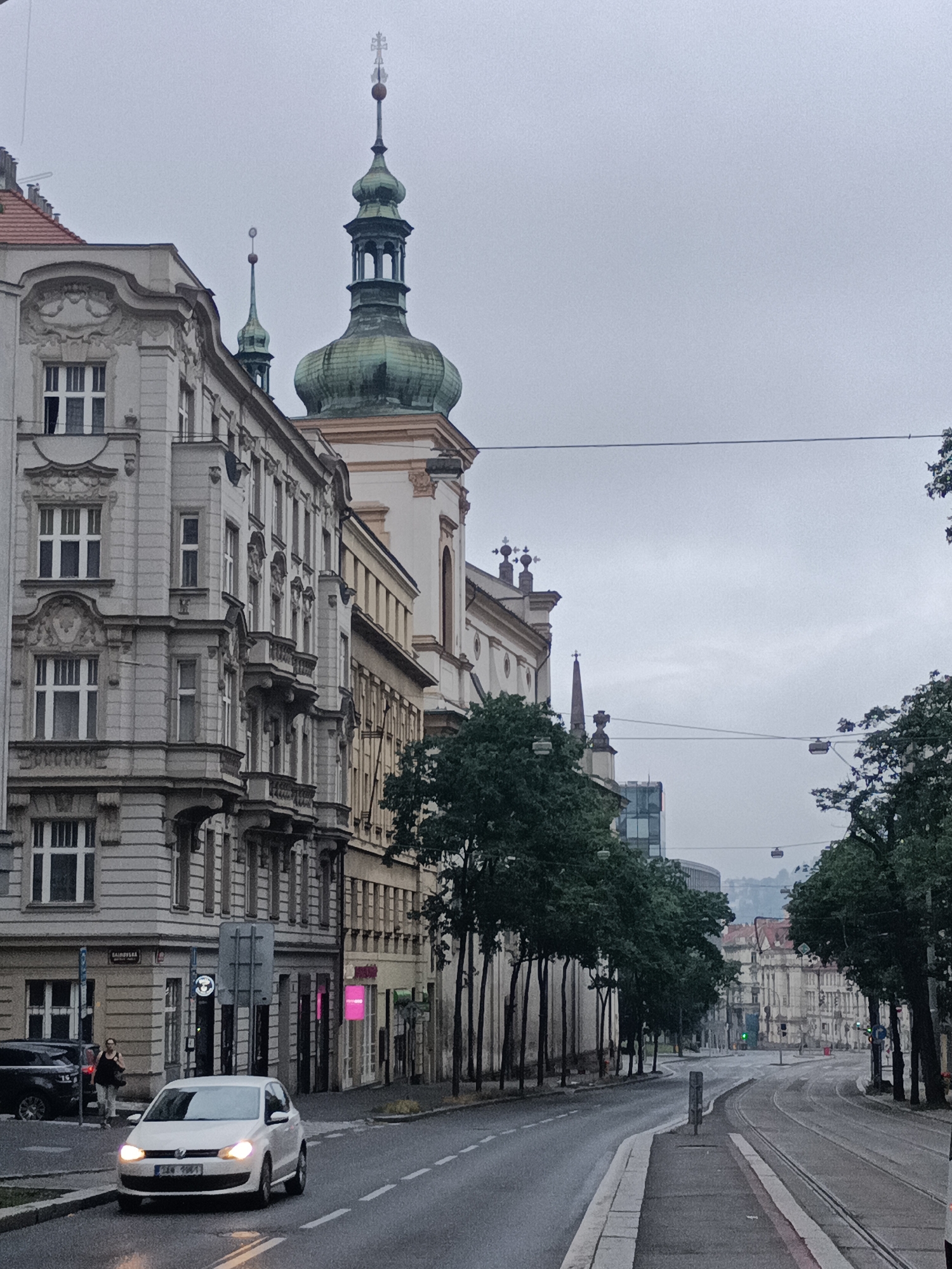 Riding Prague's tram through a cloudy city-center morning