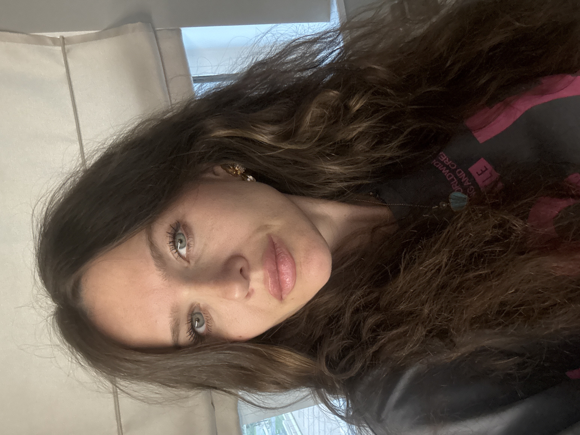 Woman takes selfie indoors in Khimki, Russia