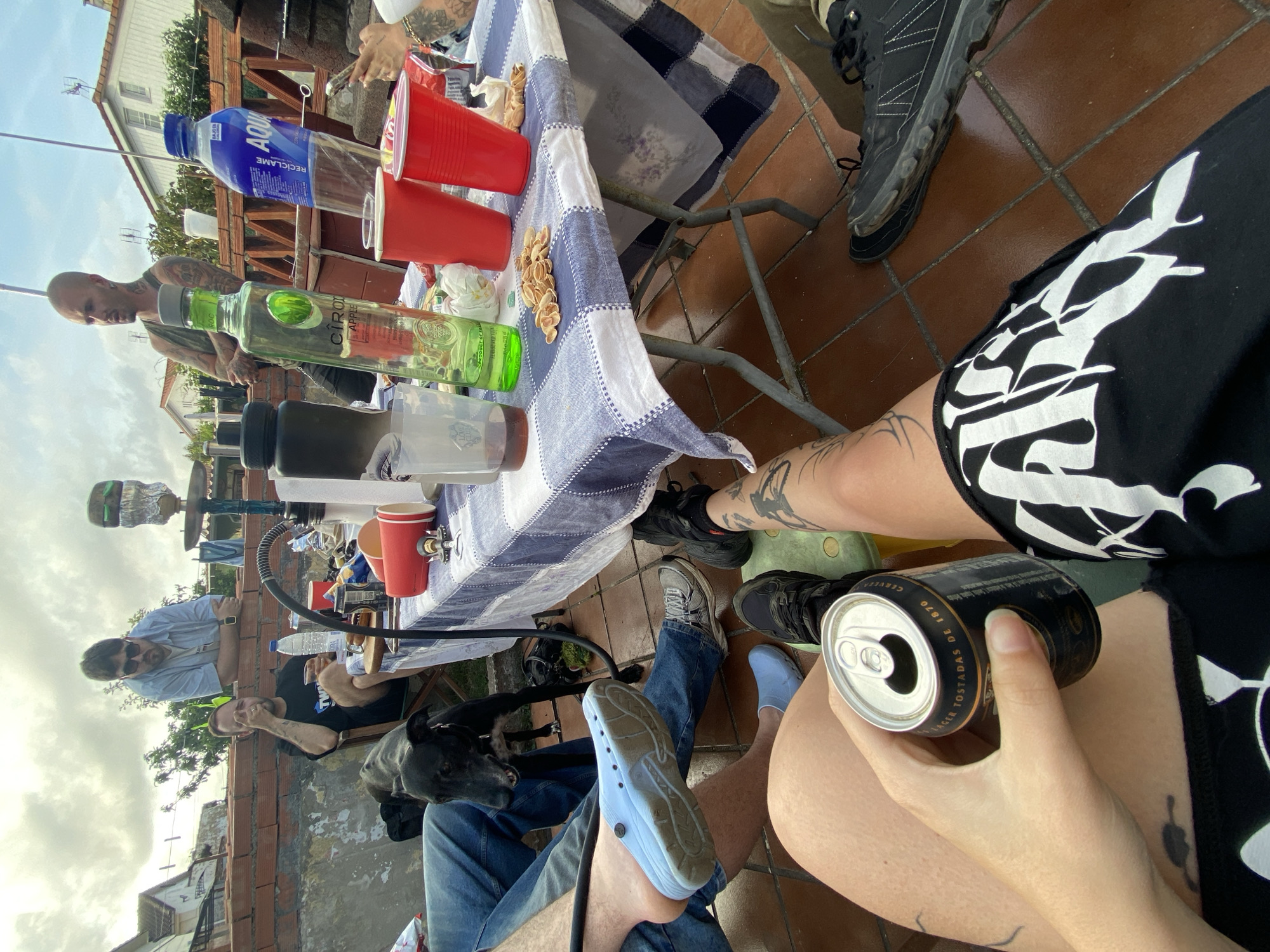 Friends gather for drinks on Gijón rooftop terrace