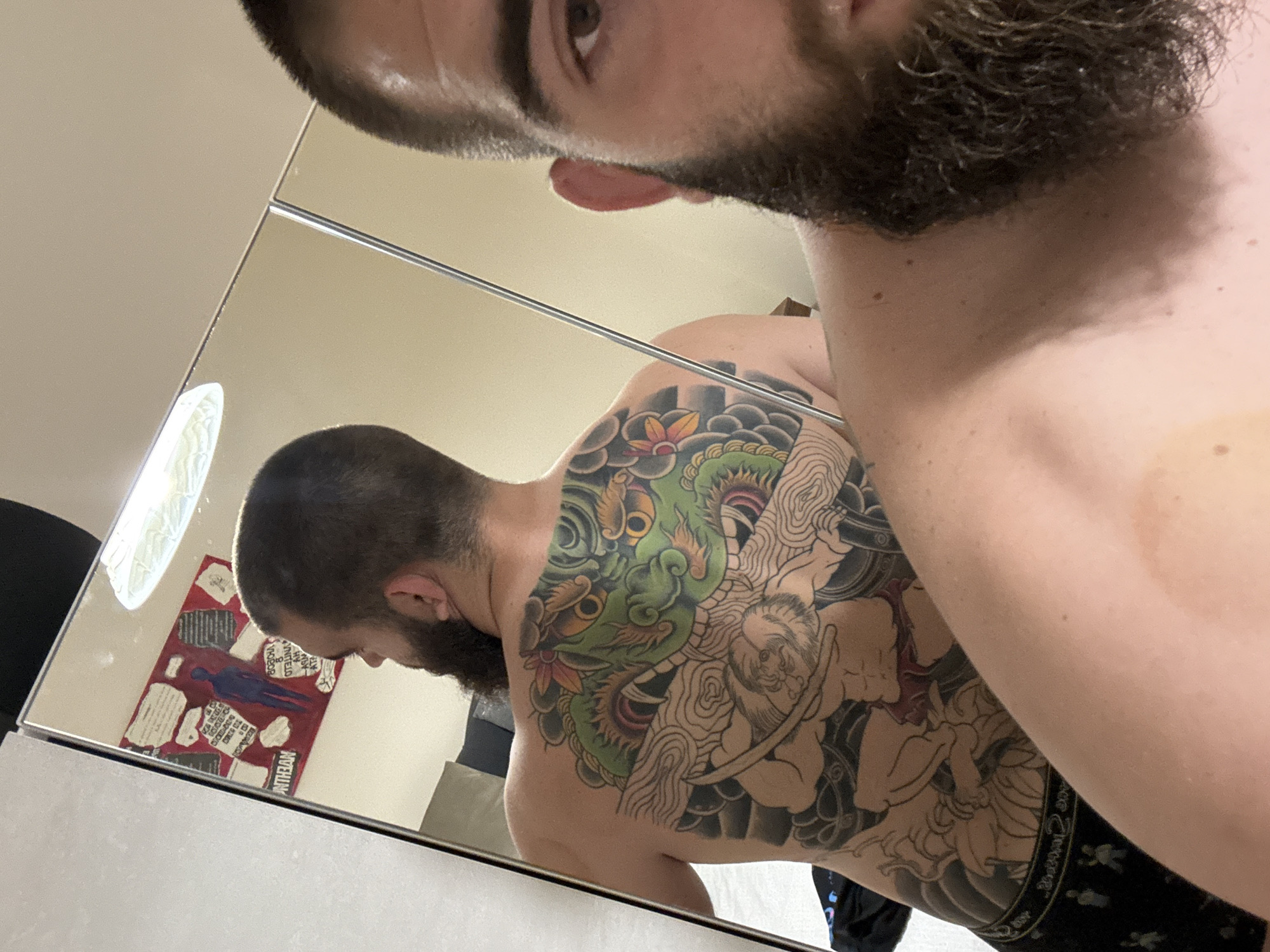 Man takes mirror selfie revealing colorful tattoo in Bulgaria