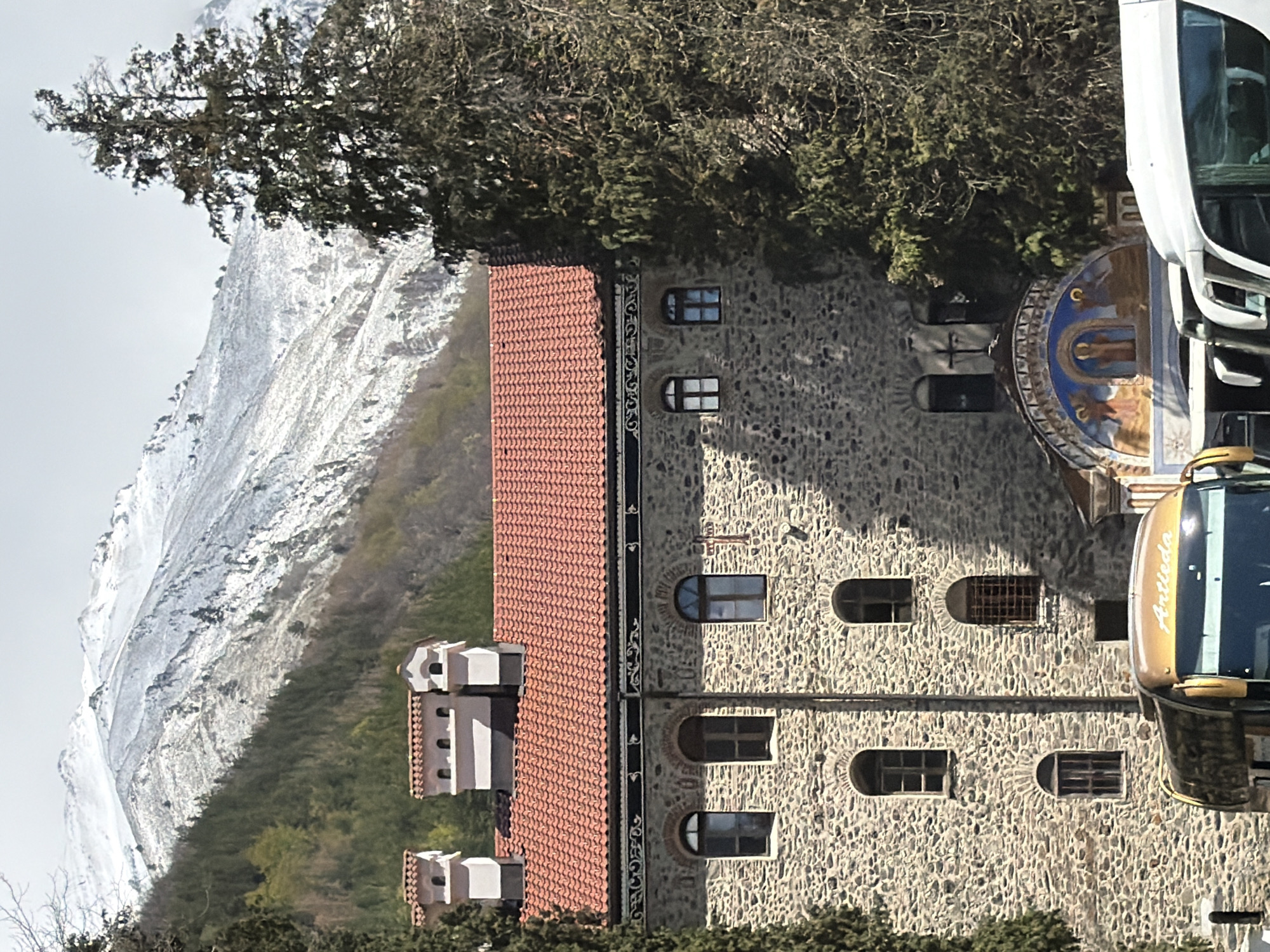 Rila Monastery captured amid snow-covered Bulgarian mountain landscape