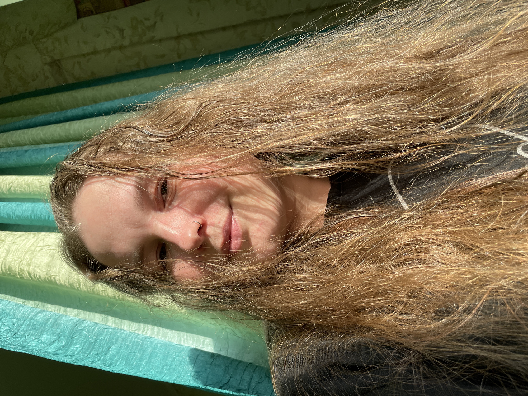 Person photographed resting on striped surface in Izhevsk