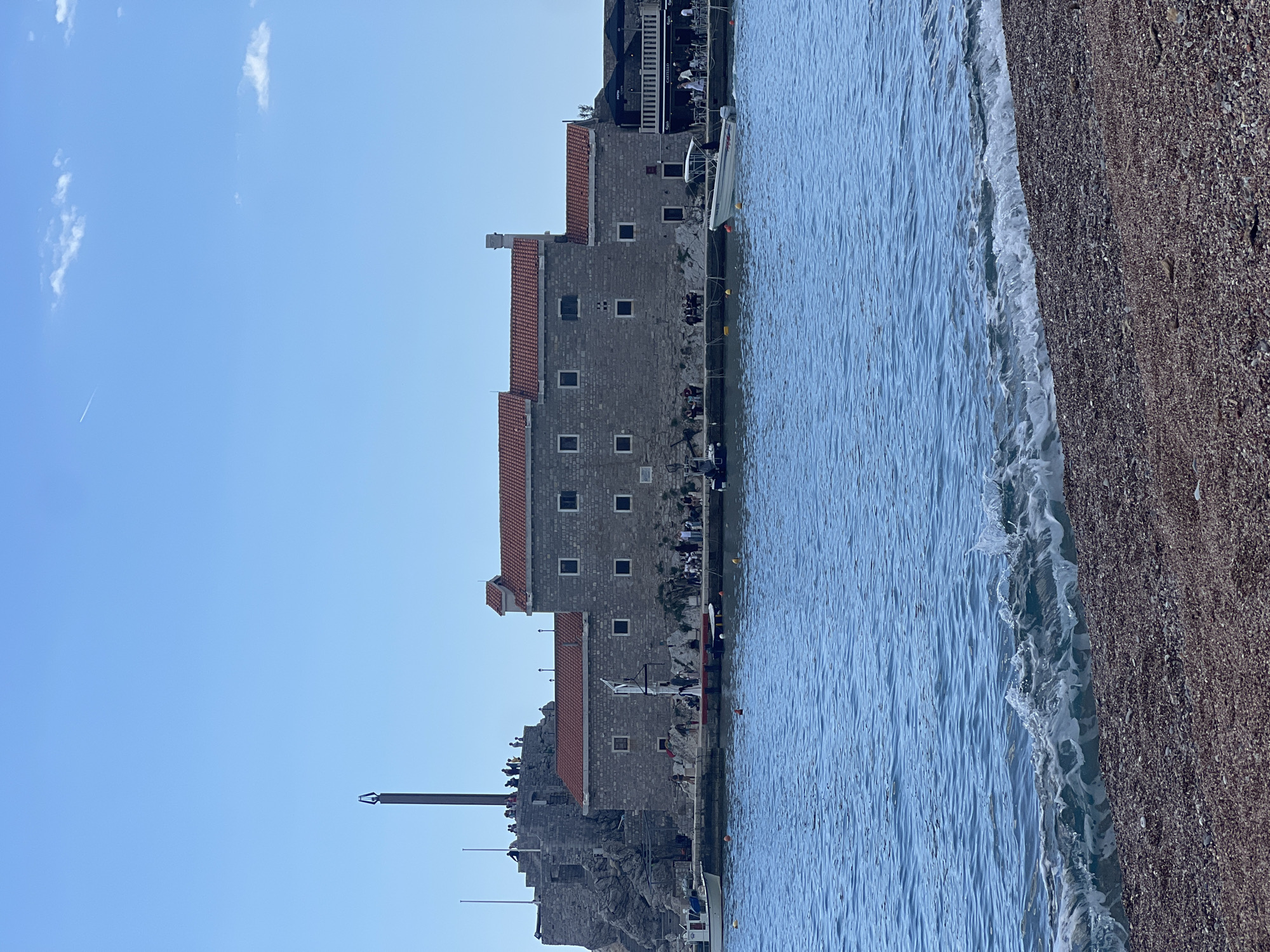 Sunny beach day draws families to Montenegro's Petrovac shores