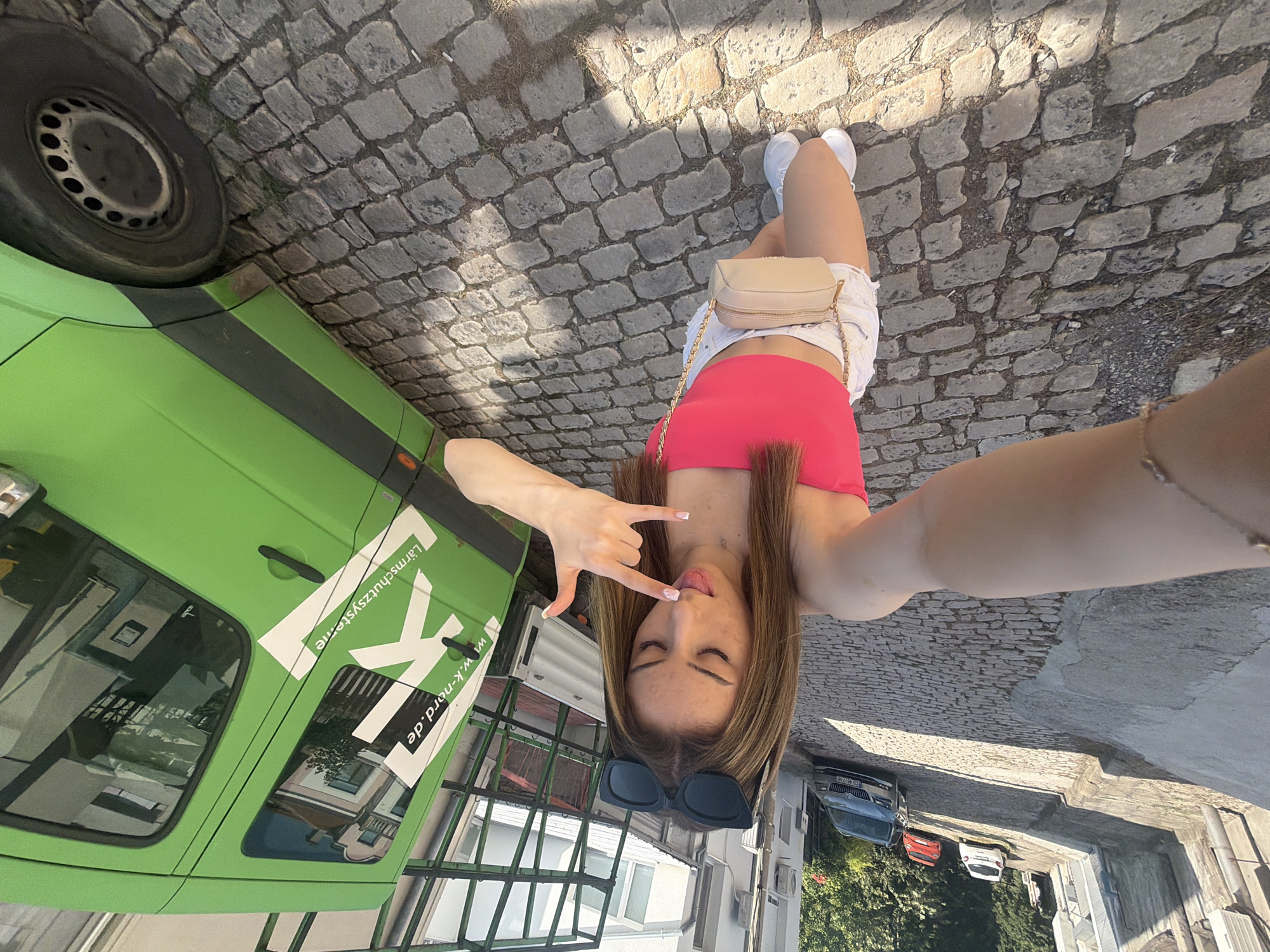 Selfie on a sunny cobblestone street in Shumen, Bulgaria