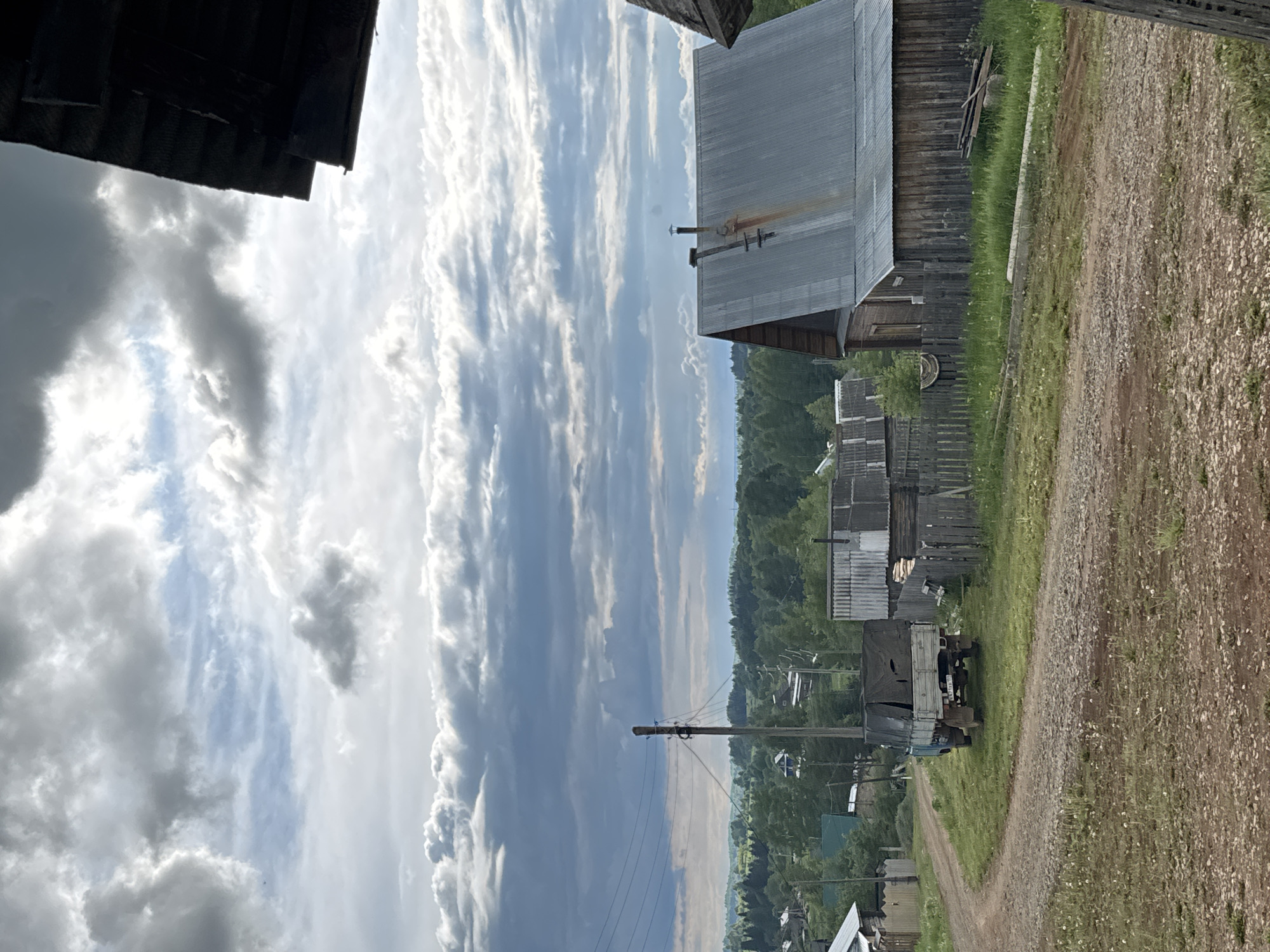 Rural life documented in Russian village under cloudy skies
