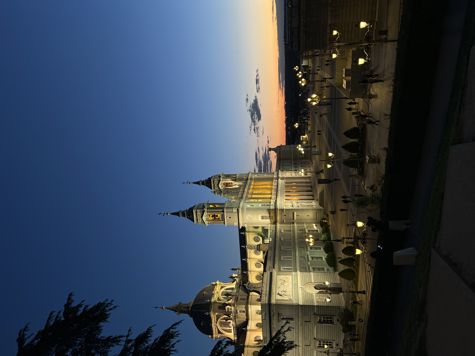 Almudena Cathedral illuminated at dusk in Madrid