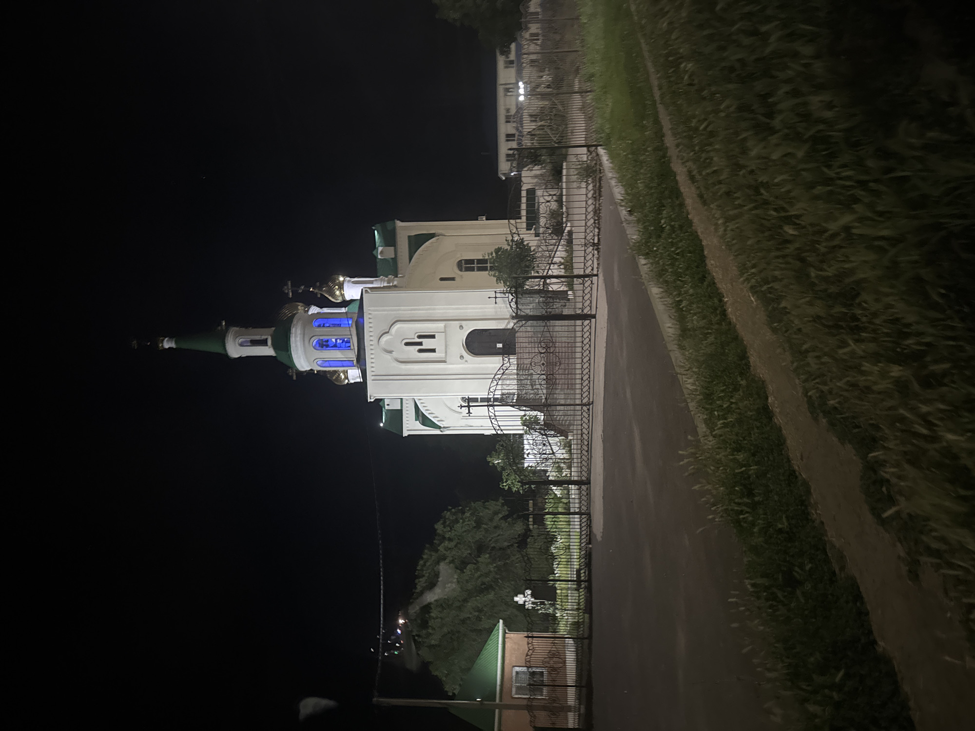 Orthodox church glows at night in Yegorlykskaya, Russia