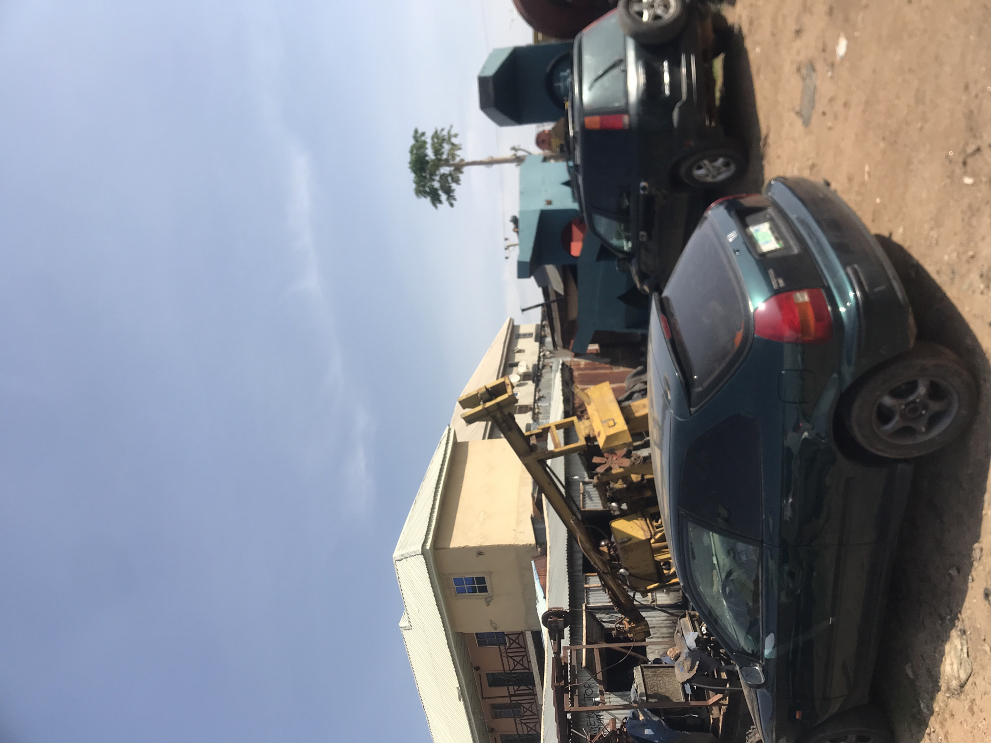 Commercial area with vehicles and crane documented in Rafin Par