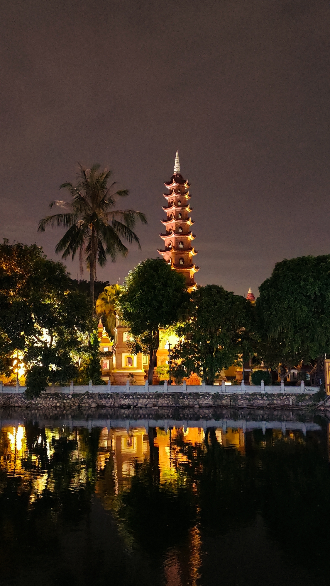 Hanoi at night: lakeside landmarks and a luxury hotel