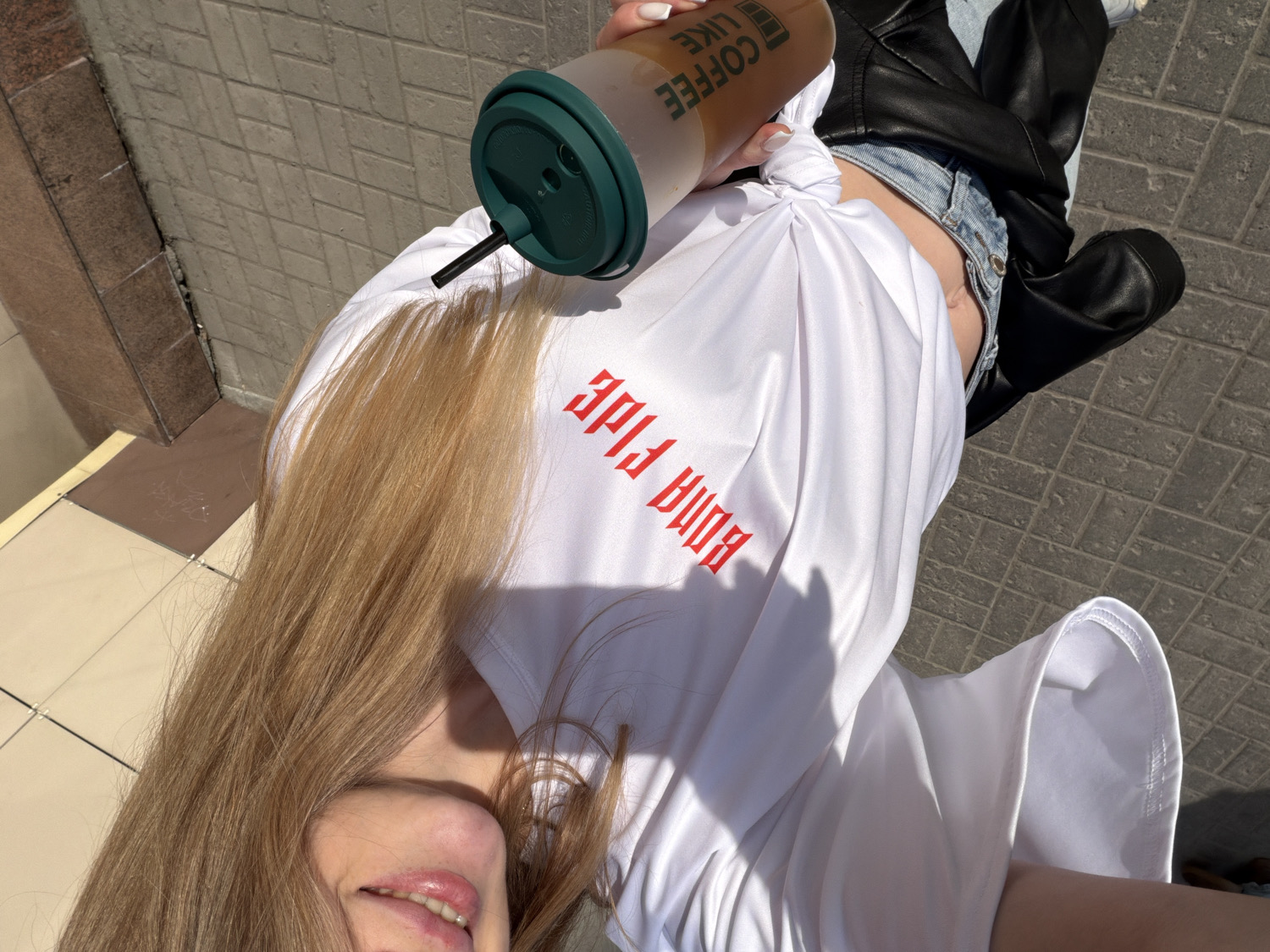 Young woman enjoys sunny day outing with dog in Barnaul