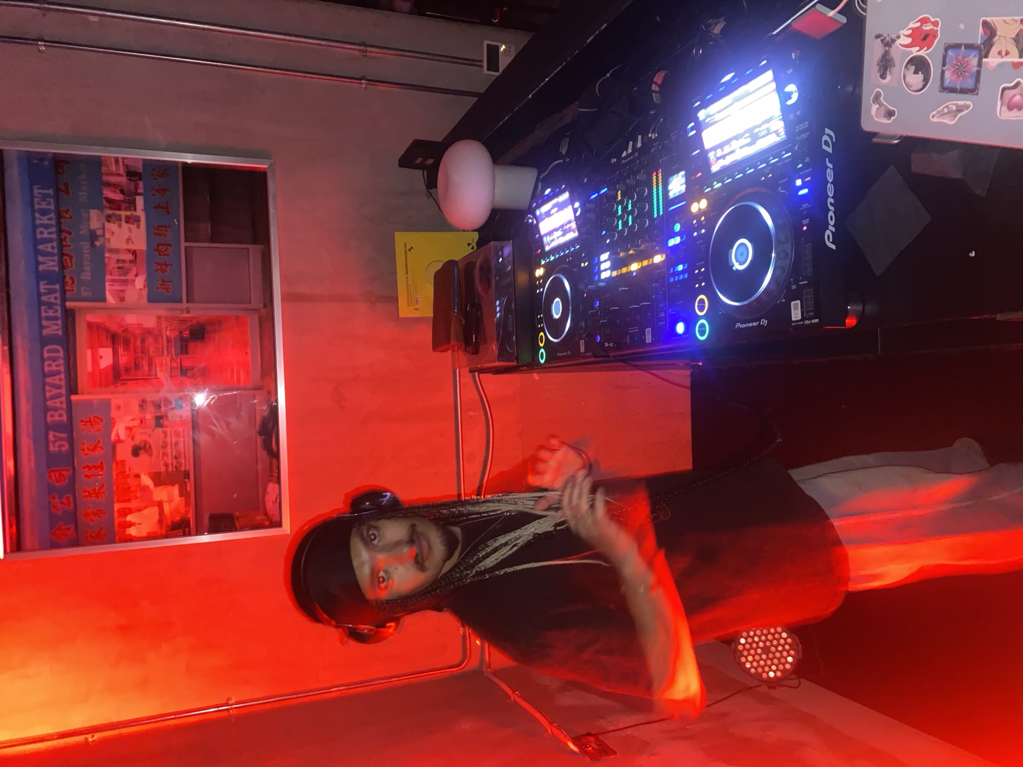 DJ performs at red-lit Dubai club as crowds gather