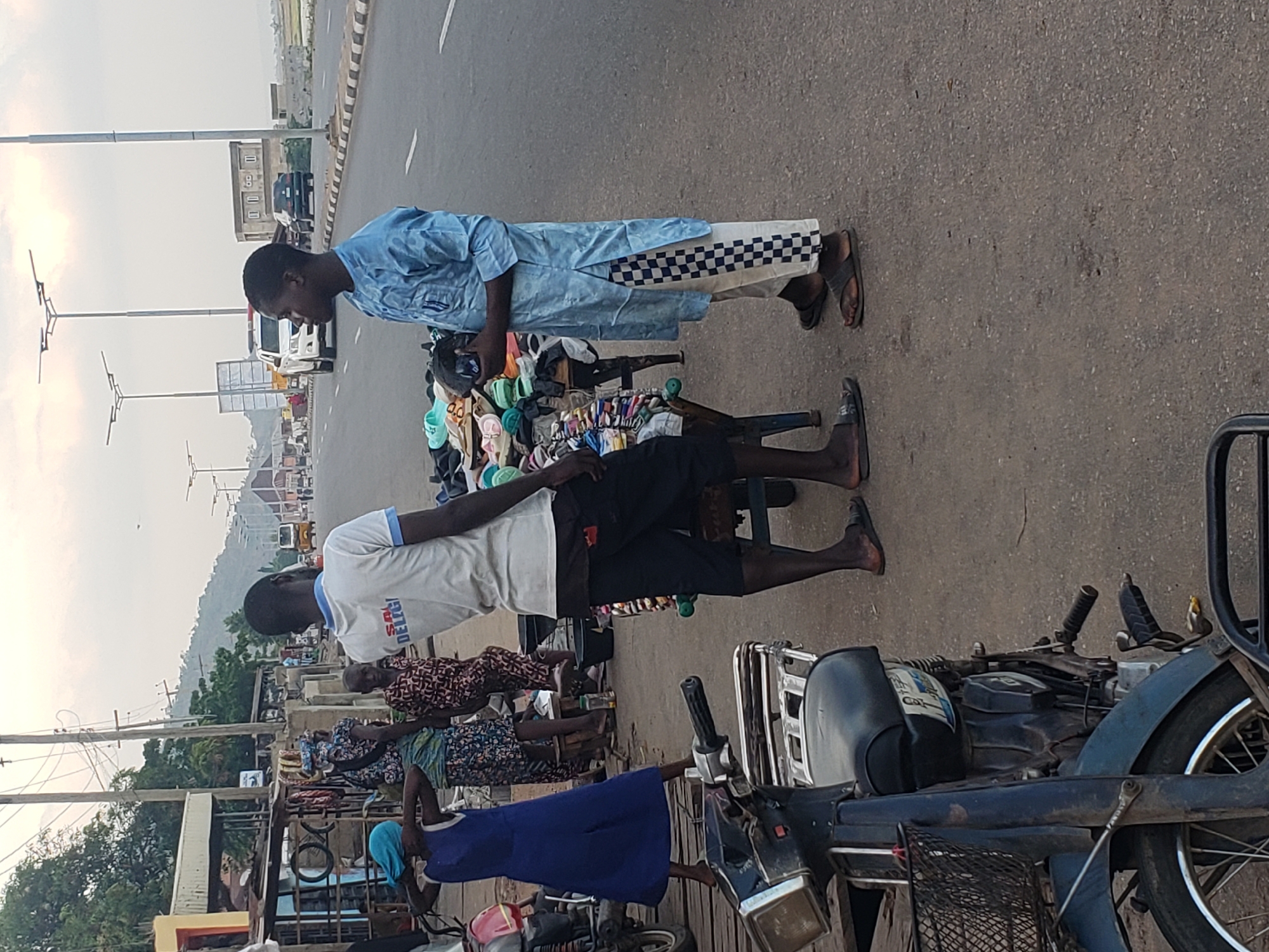 Street vendors conduct business in Lokoja, Nigeria afternoon markets