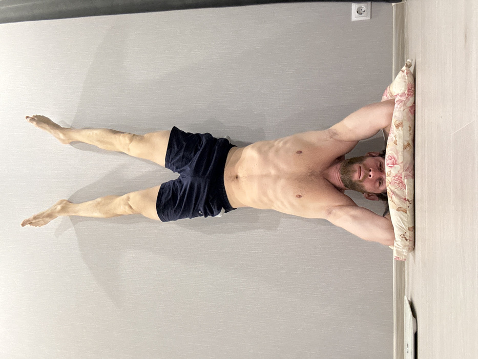 Man completes morning workout routine at home in Saint Petersburg