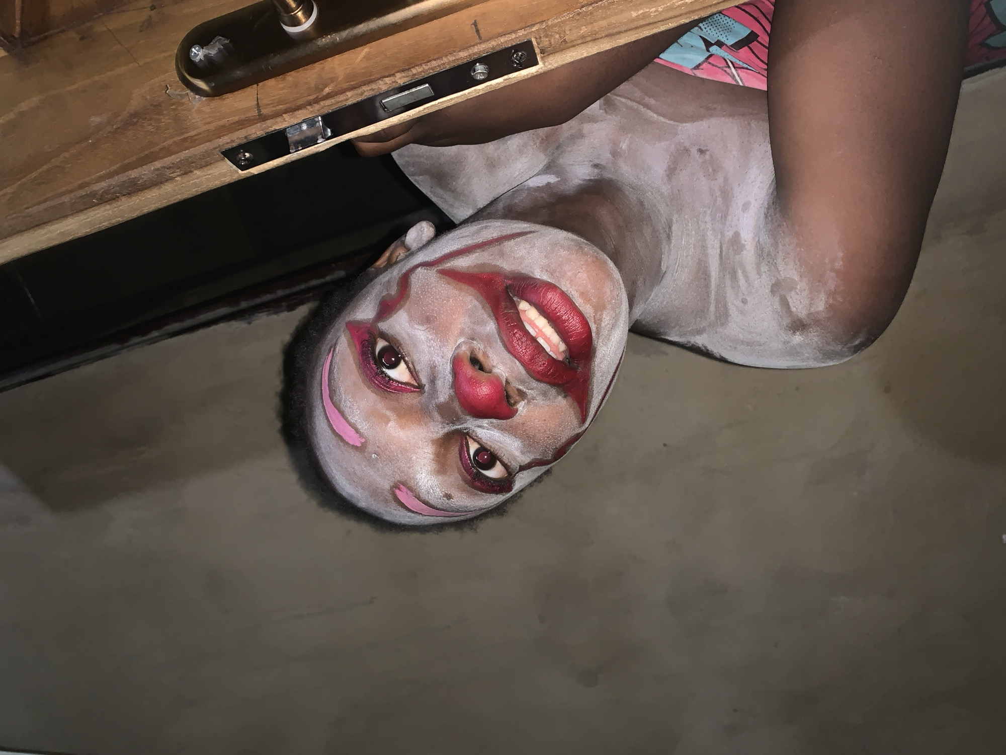Person in clown makeup documented in Agban, Nigeria