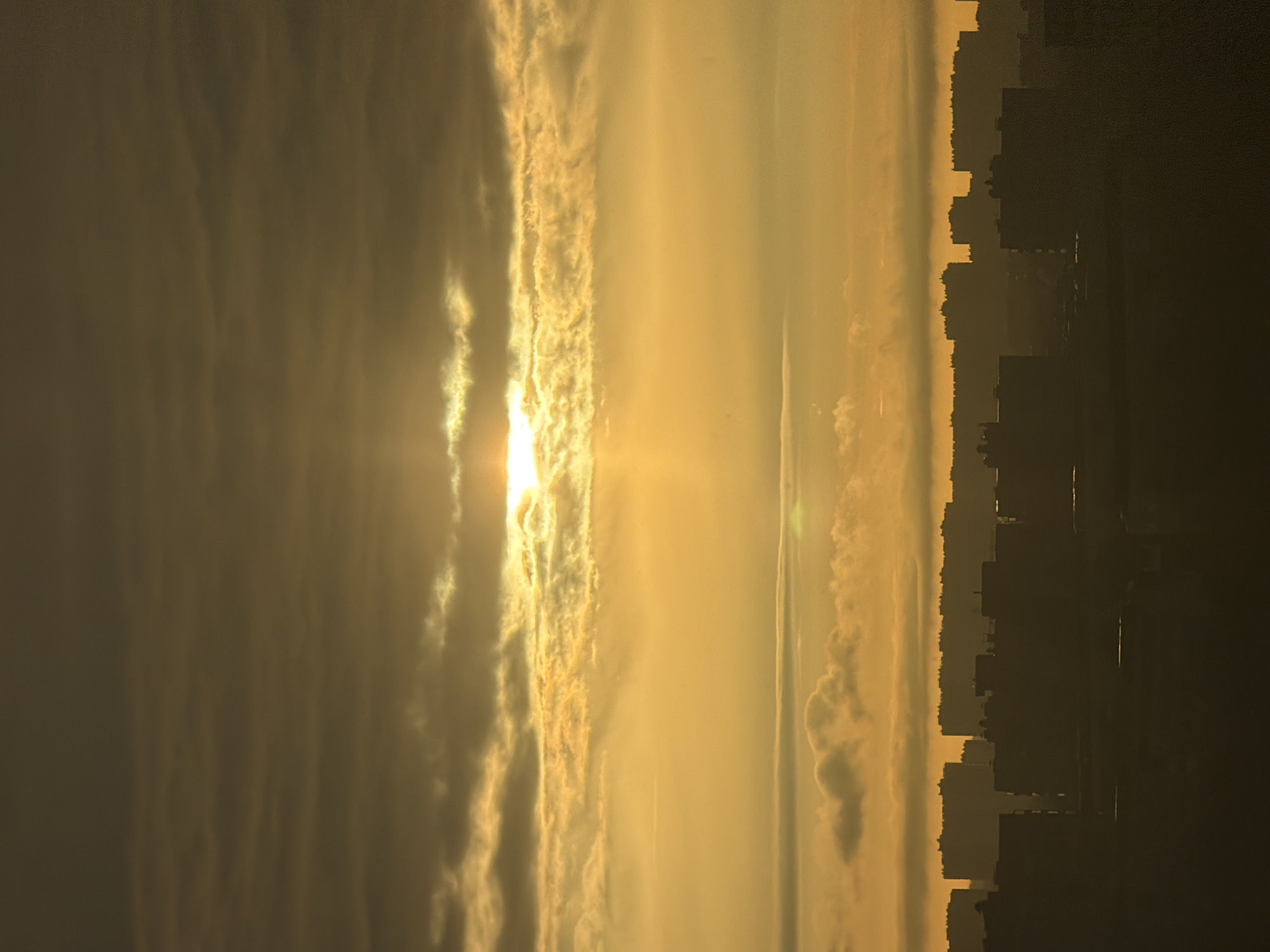 Sunset captured over Saint Petersburg skyline amid cloudy skies